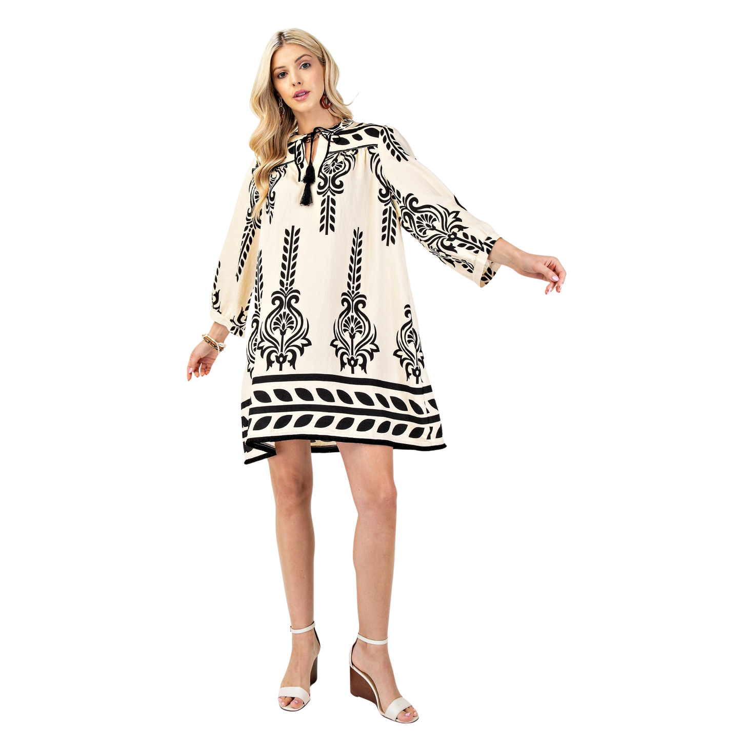 Elevate your wardrobe with this stunning ivory mini dress from GiGio. Featuring an abstract design that catches the eye, this piece combines sophistication with modern flair. The tassel tie detail adds a playful touch, while the 3/4 length sleeves provide comfortable coverage. Designed with plus-size fit in mind, this dress offers flattering proportions and confident style. Perfect for casual outings, date nights, or any occasion where you want to feel fabulous and fashion-forward.
