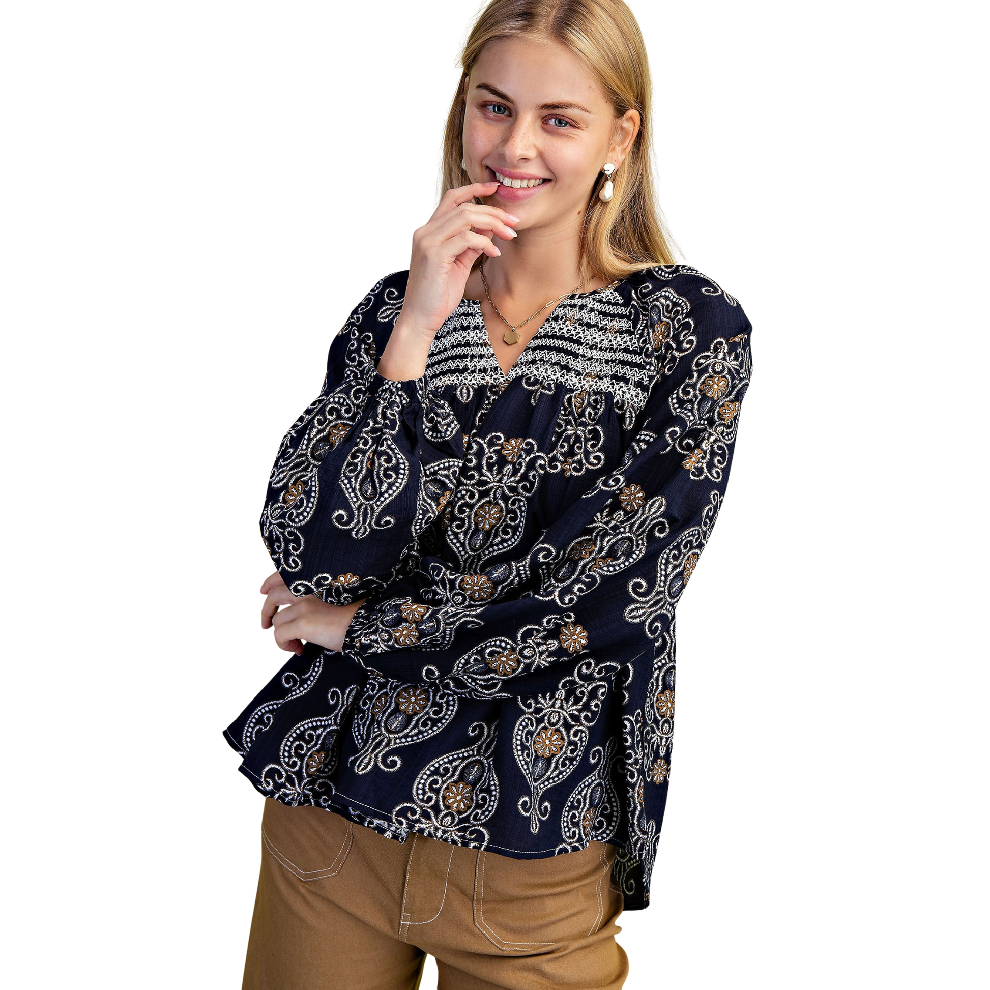 Elevate your wardrobe with the GiGio Balloon Sleeve Blouse in a sophisticated navy mix. Featuring a flattering v-neck and long sleeves, this blouse showcases decorative smocking on both front and back for subtle texture and refined detail. Its tailored design combines comfort with stylish elegance, making it an ideal choice for professional or upscale casual settings.