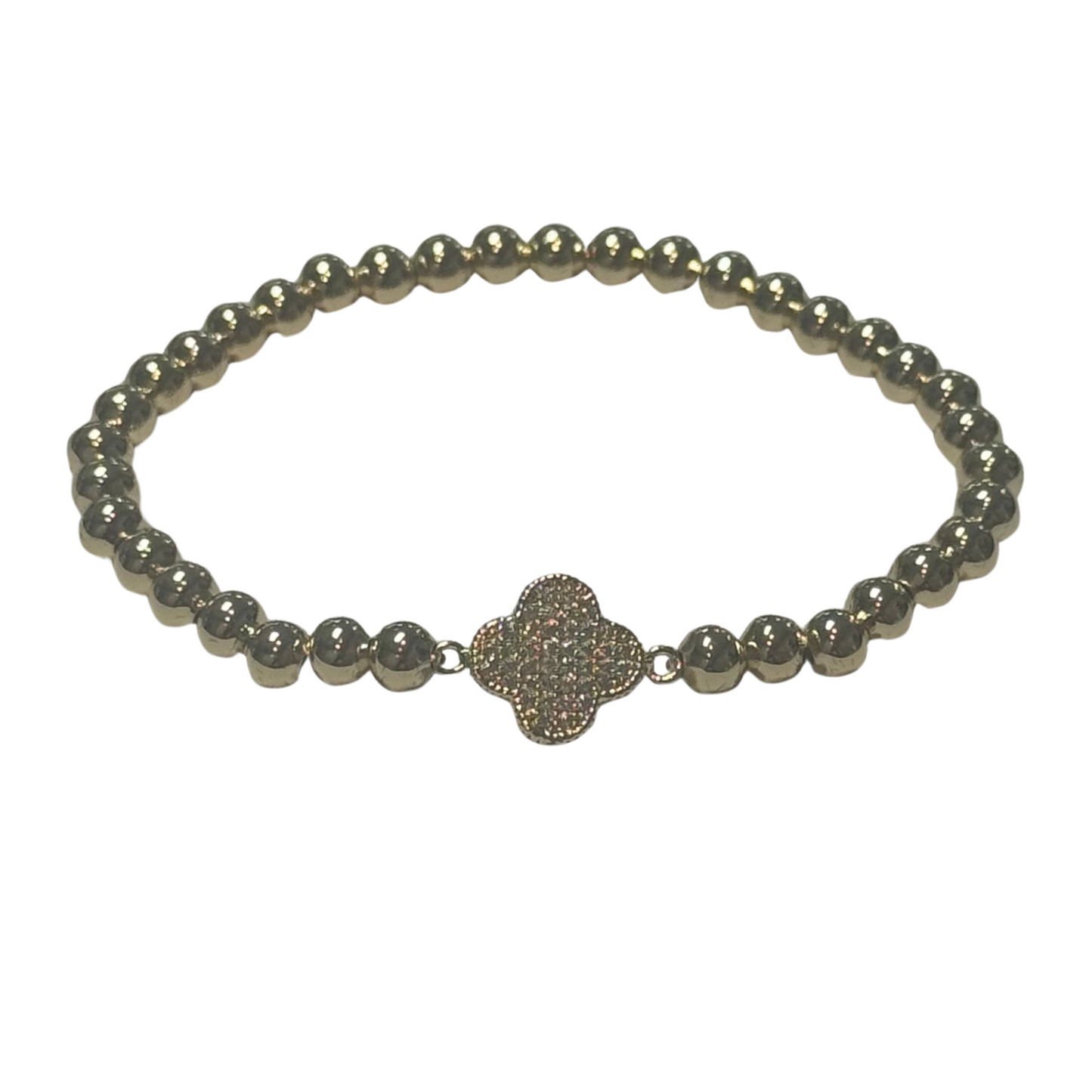 This elegant gold-toned stretchy bracelet features delicate beaded detailing and a distinctive clover accent, subtly embellished with sparkling rhinestones. Designed for a comfortable fit, it effortlessly combines style and versatility, making it an expert choice for adding a refined touch to any outfit.