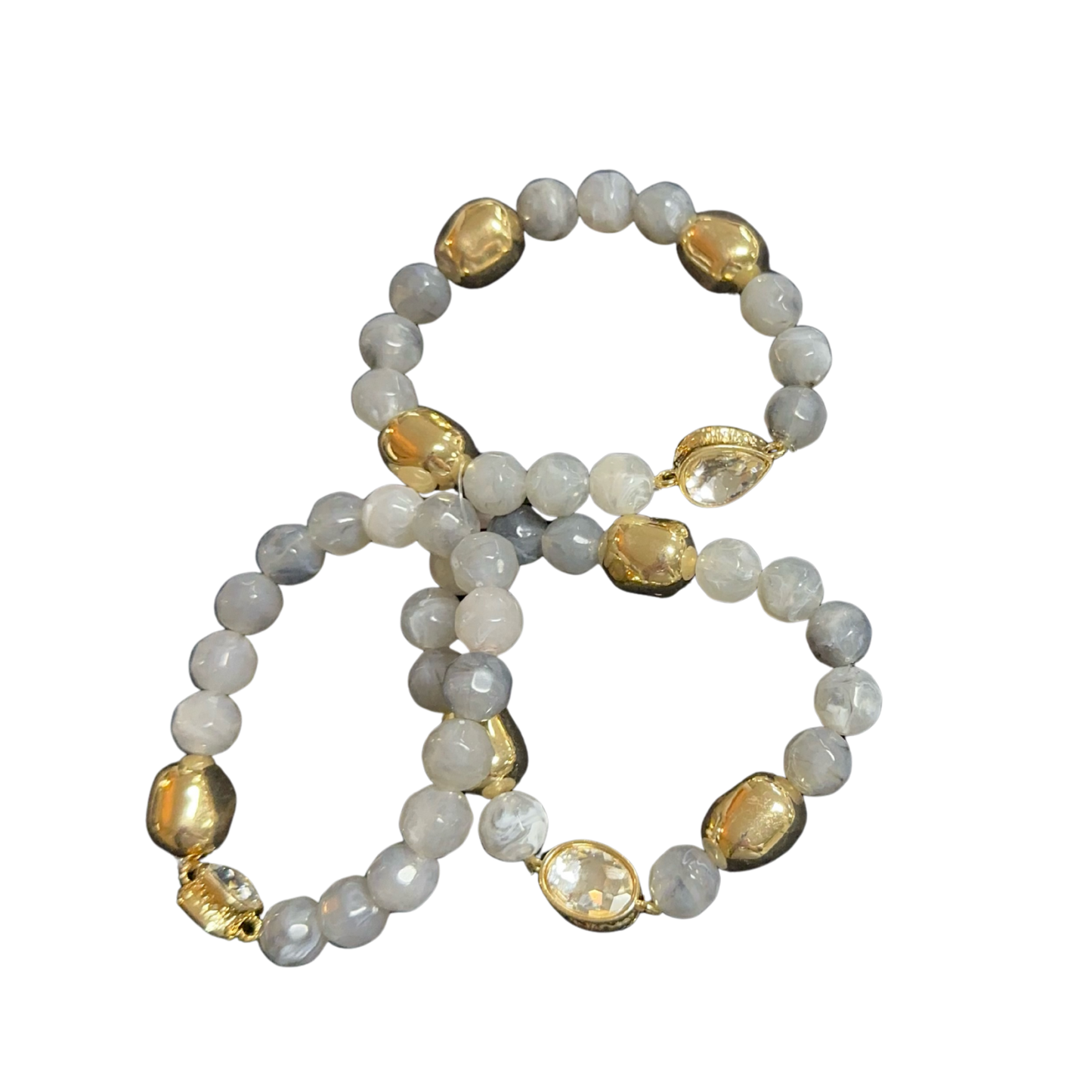 Elevate your accessory collection with this curated set of three stretchy bracelets from Perdido Gems. Each bracelet features meticulously selected beads with a captivating iridescent finish that shifts beautifully across the light spectrum. The elastic construction ensures a comfortable, adjustable fit for any wrist size, making these pieces versatile enough for layering or wearing individually. Perfect for adding dimensional color and sophisticated sparkle to both casual and refined looks.