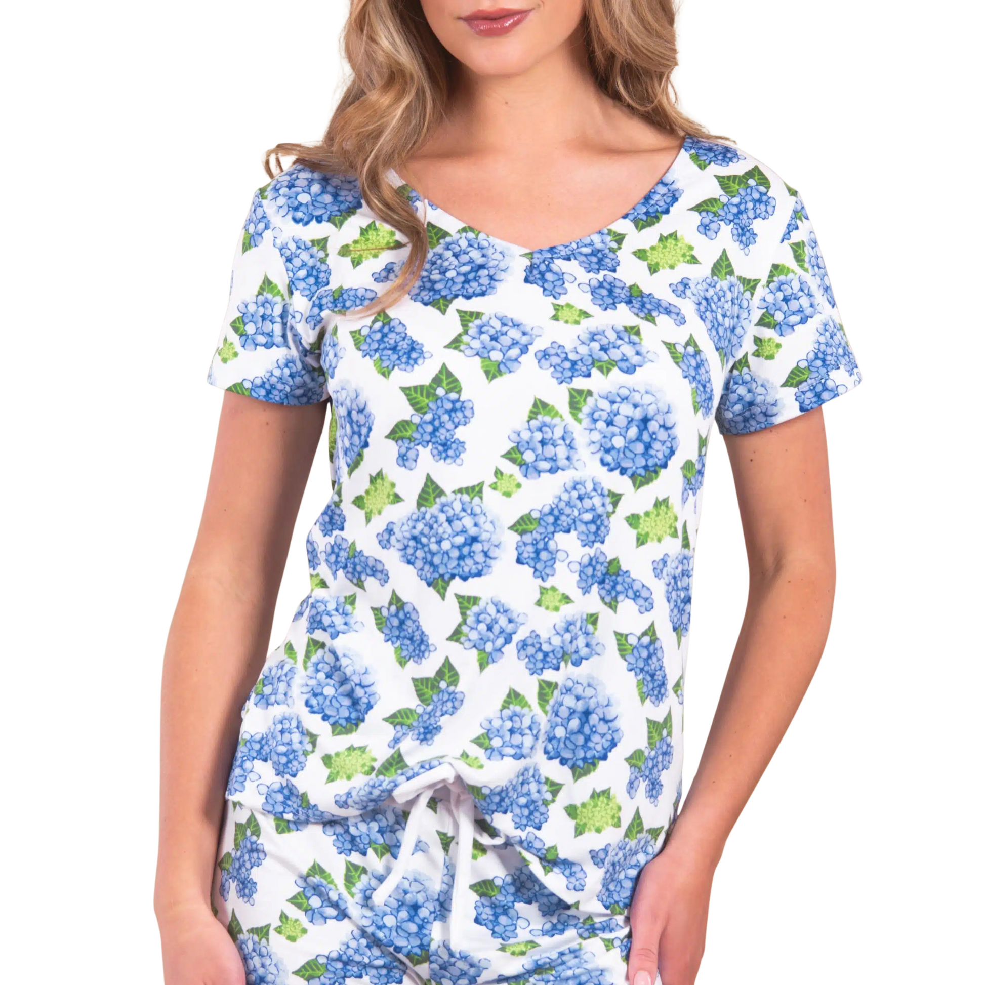 Elevate your relaxation with the Blue Hydrangea Pajama Top by Amanda Blu. Featuring a delicate hydrangea design, this loungewear top combines a flattering V-neck and comfortable short sleeves for effortless style and ease. Crafted for both comfort and elegance, it’s perfect for unwinding at home while maintaining a polished look.