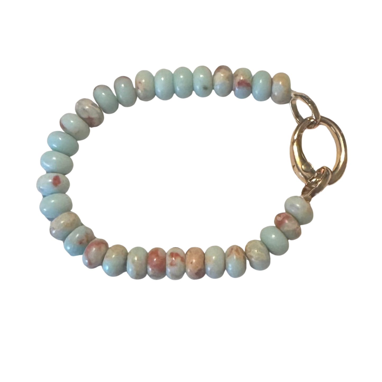 This blue beaded bracelet from Perdido Gems showcases expertly selected gemstone beads in rich azure tones, complemented by gold accents that enhance its refined aesthetic. Each bead is chosen for quality and consistency, creating a balanced design that transitions seamlessly from casual to formal settings. The combination of cool blue hues with warm gold tones demonstrates sophisticated color theory in jewelry design. A versatile piece that adds depth and character to any collection.