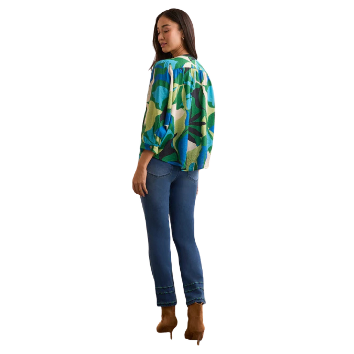 This Flowy Dolman Sleeve Blouse features a vibrant abstract print in a dynamic blue and green mix, reflecting the distinctive style of Tribal brand. Designed with a button-up top for easy wear, its relaxed dolman sleeves offer comfort and fluid movement. Perfect for elevating casual ensembles with a touch of artistic flair and expert craftsmanship.
