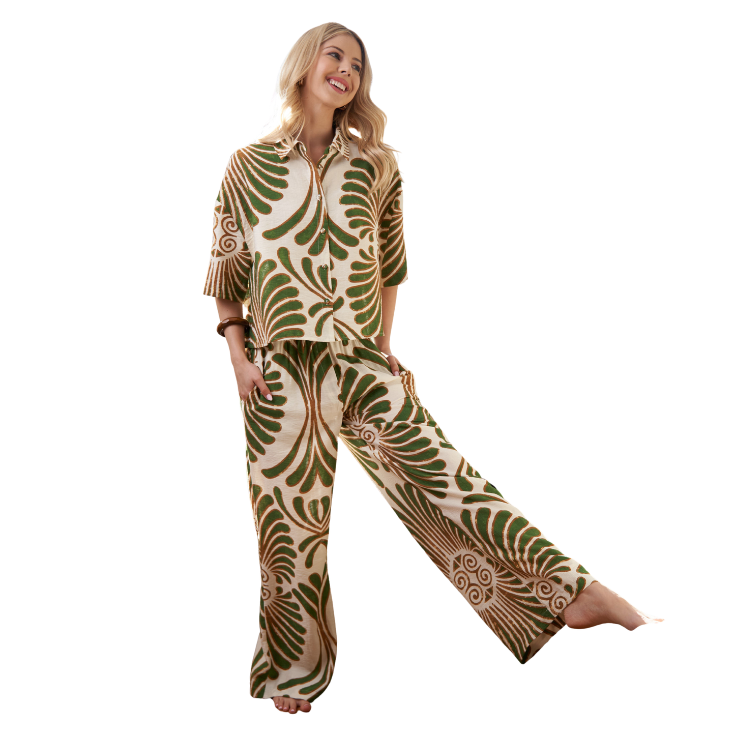 Make a statement with this striking GiGio top and bottom set. The bold green print cropped top pairs perfectly with matching wide-leg pants for an effortlessly chic look. This coordinated two-piece set offers versatile styling—dress it up for nights out or keep it casual for everyday wear. The cropped silhouette balances the relaxed fit of the wide-leg pants, creating a flattering, modern silhouette. Perfect for anyone looking to add confident, eye-catching pieces to their wardrobe.