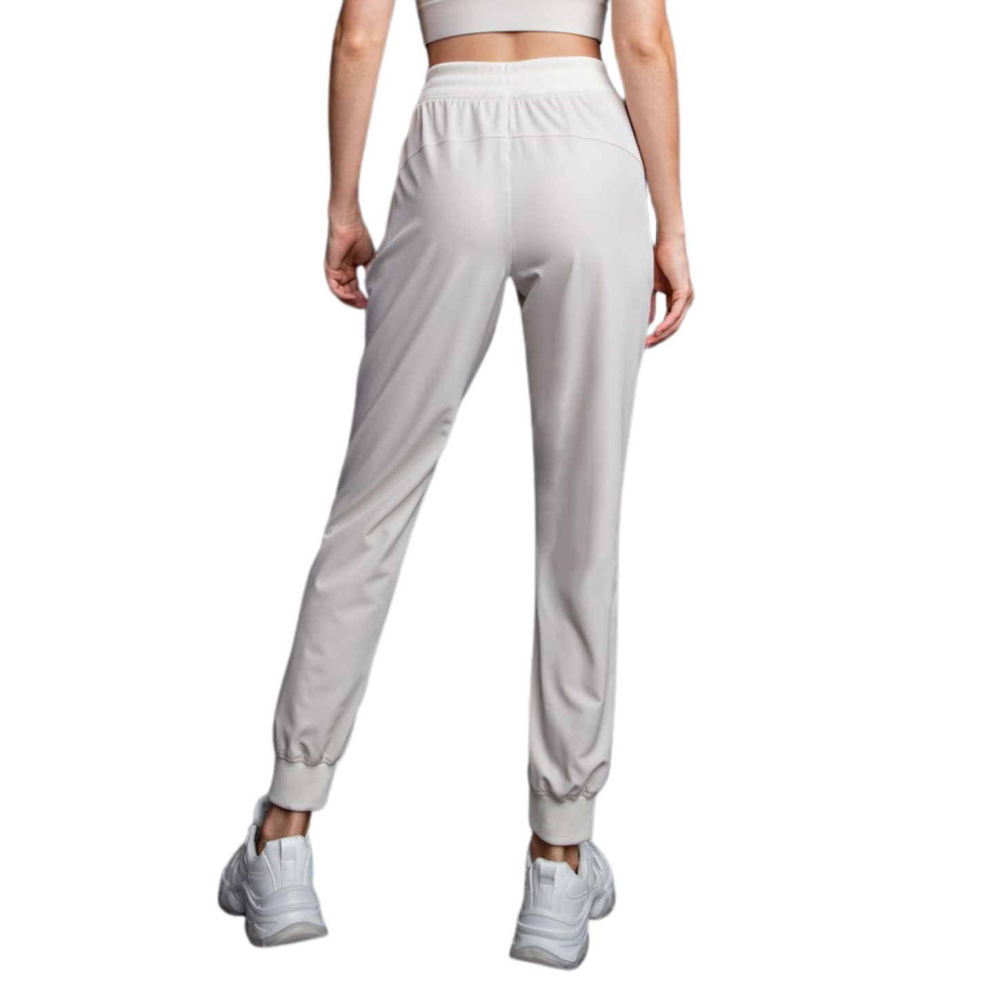 Take your workout to the next level with our Oxford Mid Rise Joggers. Crafted from durable Oxford St Woven fabric, these Dance Studio inspired jogger pants provide maximum comfort and flexibility. With a flattering mid rise fit and timeless bone color, these joggers are the perfect addition to your fitness wardrobe.