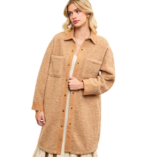 This Boucle Textured Jacket by Mustard Seed features a sophisticated latte color, button-up closure, and practical pockets. Its textured design adds a touch of elegance to any outfit. Stay warm and stylish this season with this expertly crafted jacket.