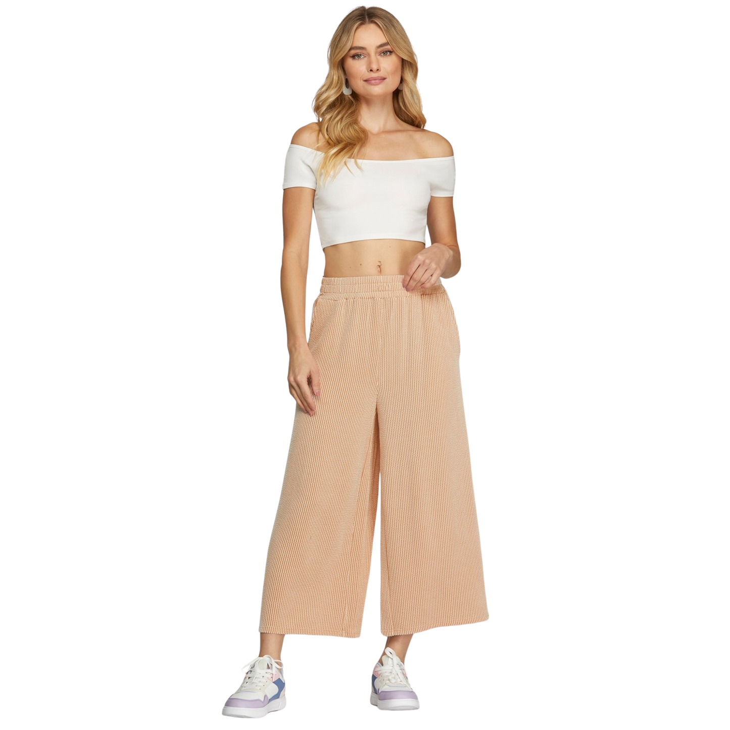 Textured Knit Capri Pants in a soft, light taupe hue that pairs effortlessly with any wardrobe. Crafted by She+Sky, these wide-leg pants offer a relaxed, comfortable fit perfect for everyday wear. The subtle texture adds visual interest while maintaining a refined, understated look. Ideal for casual outings or lounging at home, they deliver style without compromise.