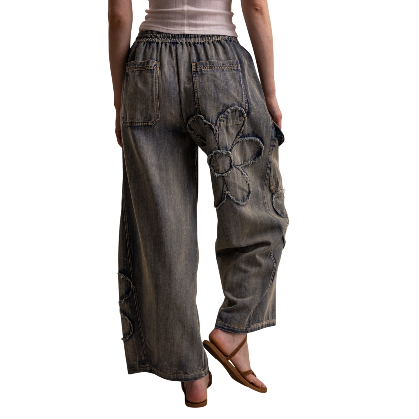 Effortless style meets comfort in these Blue Velvet Flower Cargo Denim Pants. Crafted from light denim, these baggy wide-leg pants feature a charming flower patchwork design that adds personality to any outfit. The adjustable drawstring waist ensures a perfect fit, while the relaxed silhouette provides all-day wearability. Perfect for casual days when you want to look put-together without sacrificing comfort.