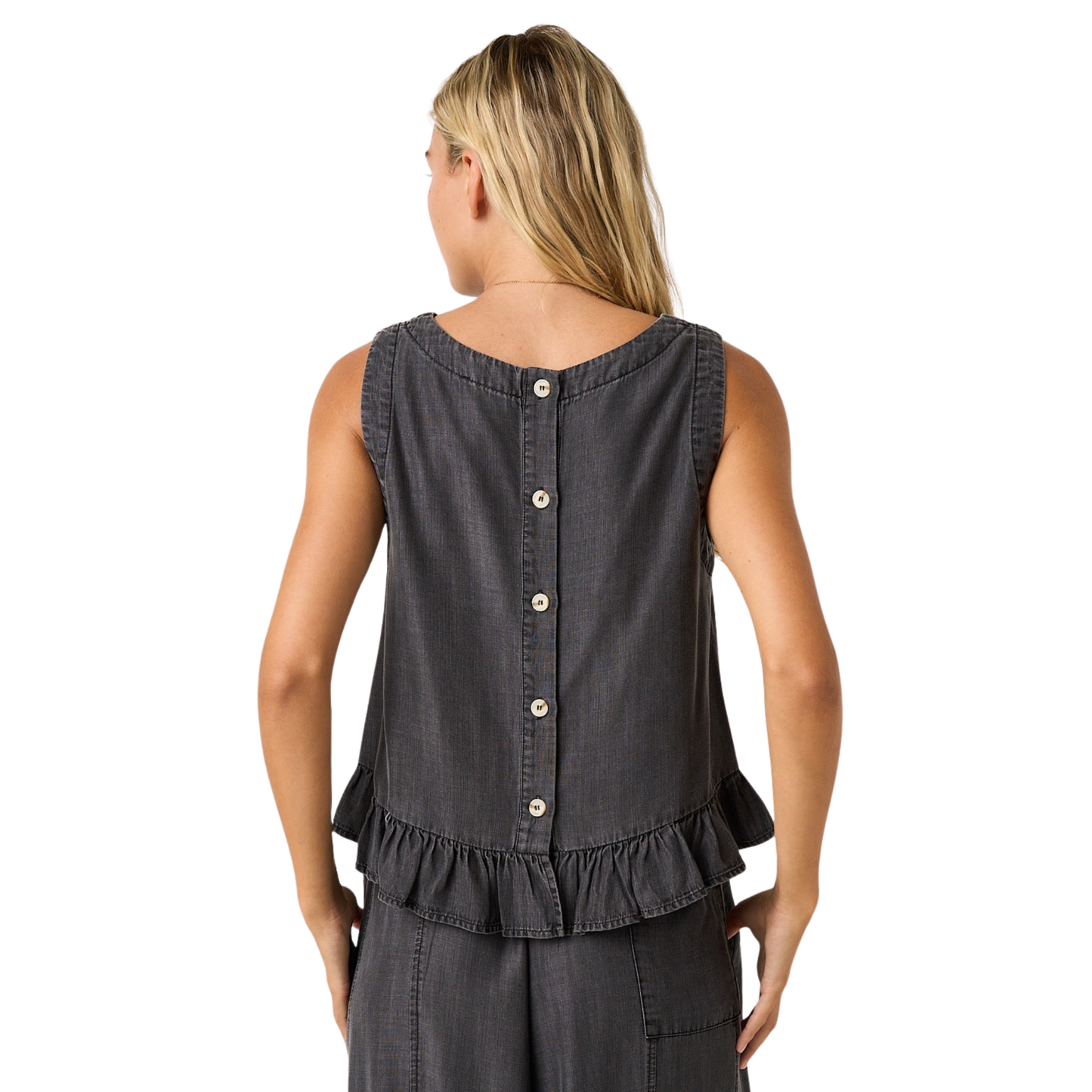 Elevate your casual wardrobe with this charming Chambray Ruffle Tank Top by Mittoshop. Crafted in crisp black chambray, this piece features delicate ruffle detailing that adds feminine flair to any outfit. The buttoned back design offers both style and practicality, making it easy to slip on and adjust for the perfect fit. Versatile enough for everyday wear or dressed up for special occasions, this tank top pairs effortlessly with jeans, skirts, or shorts.