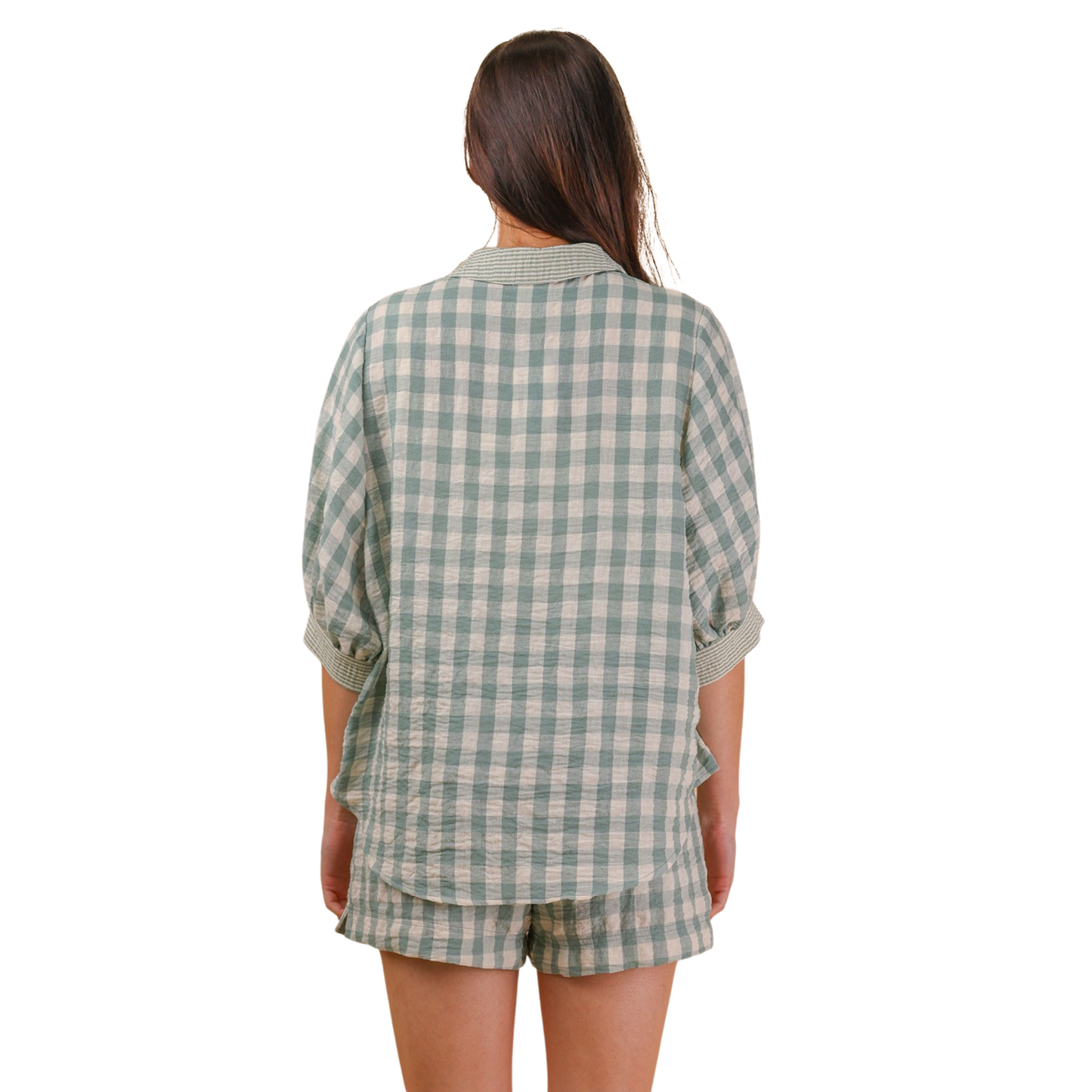 Effortless style meets comfort in this She+Sky checkered set. The short sleeve top pairs perfectly with matching shorts in a calming sage hue, creating a coordinated look that's ideal for casual days. The classic checkered pattern adds visual interest while remaining versatile enough to mix and match with your existing wardrobe. Perfect for lounging, running errands, or weekend hangouts.
