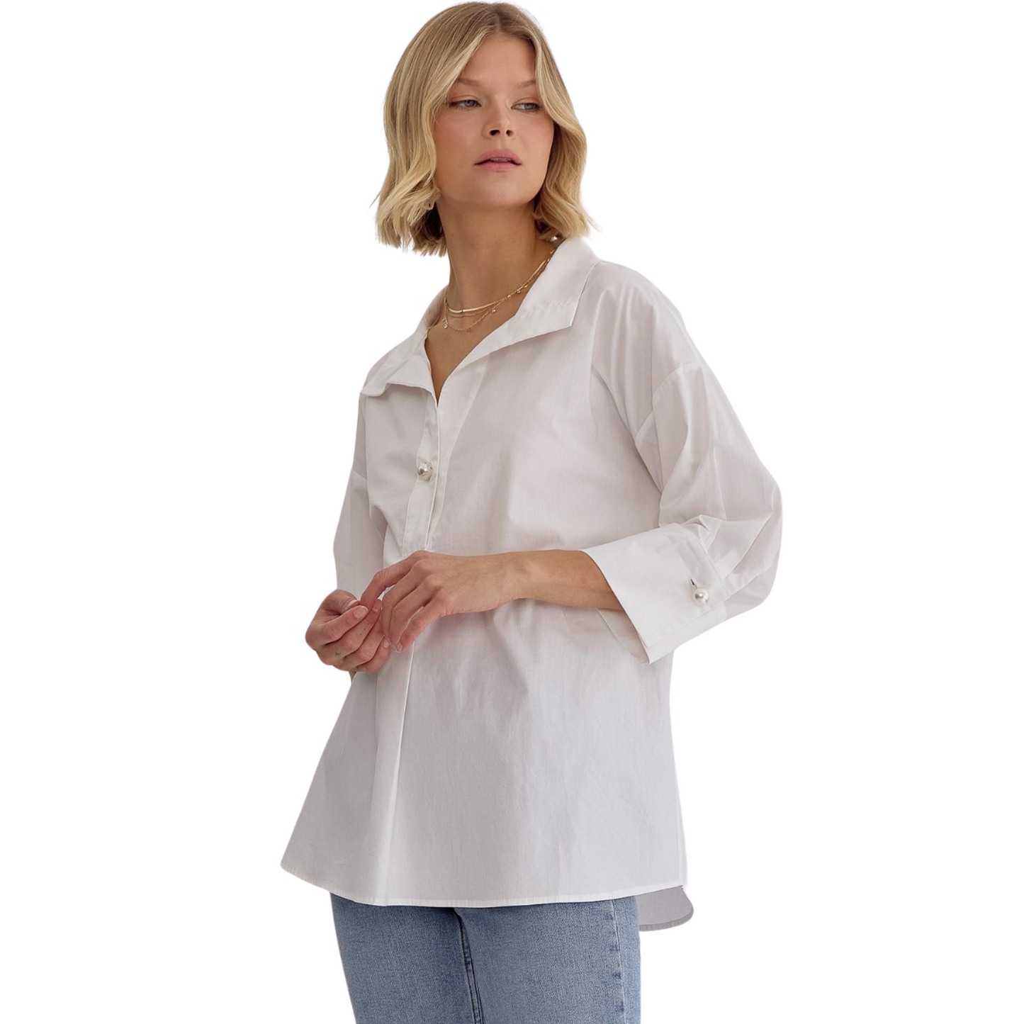 Expertly crafted with a solid design, this collared top offers a faux pearl button closure at the bust and cuffs for added elegance. The 3/4 sleeves provide coverage while keeping you cool, making it perfect for any occasion. Unlined and lightweight, this non-sheer top is a must-have addition to your wardrobe. Available in plus size and classic white.