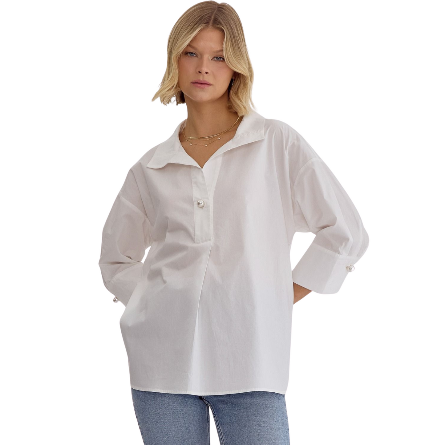 Expertly crafted with a solid design, this collared top offers a faux pearl button closure at the bust and cuffs for added elegance. The 3/4 sleeves provide coverage while keeping you cool, making it perfect for any occasion. Unlined and lightweight, this non-sheer top is a must-have addition to your wardrobe. Available in plus size and classic white.
