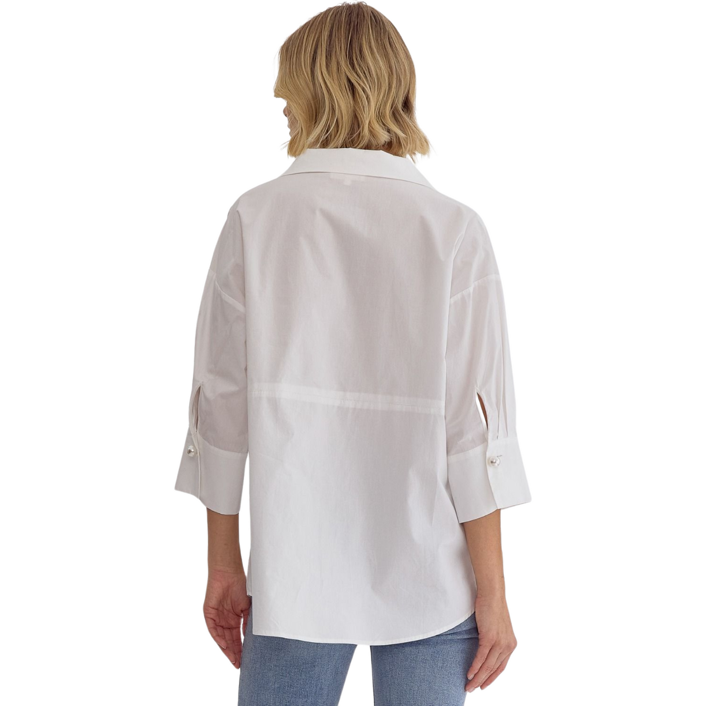 Expertly crafted with a solid design, this collared top offers a faux pearl button closure at the bust and cuffs for added elegance. The 3/4 sleeves provide coverage while keeping you cool, making it perfect for any occasion. Unlined and lightweight, this non-sheer top is a must-have addition to your wardrobe. Available in plus size and classic white.