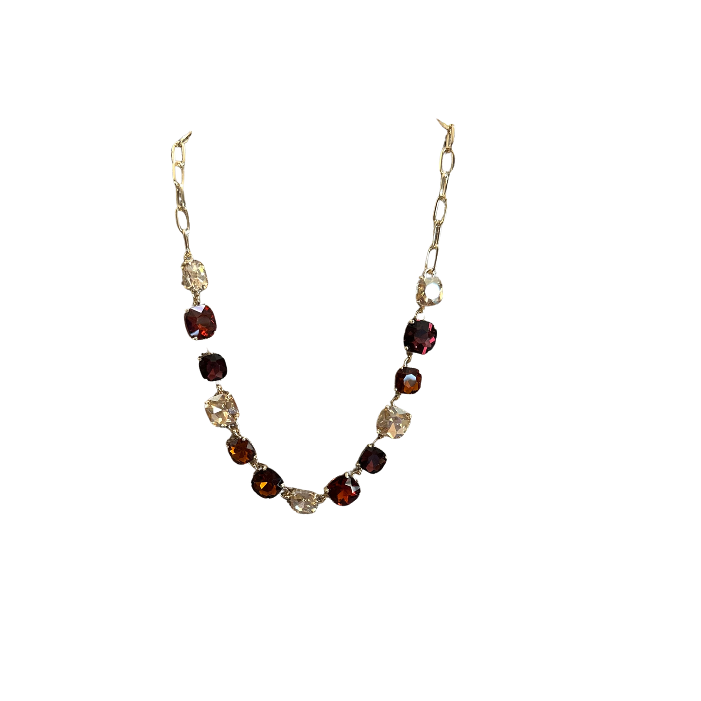 Elevate your everyday look with this stunning Colored Rhinestone Necklace by Perdido Gems. Featuring vibrant multicolor rhinestones set in lustrous gold, this short necklace adds instant sparkle and sophistication to any outfit. Perfect for layering or wearing solo, it's the ideal accessory for both casual days and special occasions. The eye-catching design catches light beautifully, making it a versatile piece that complements any style.