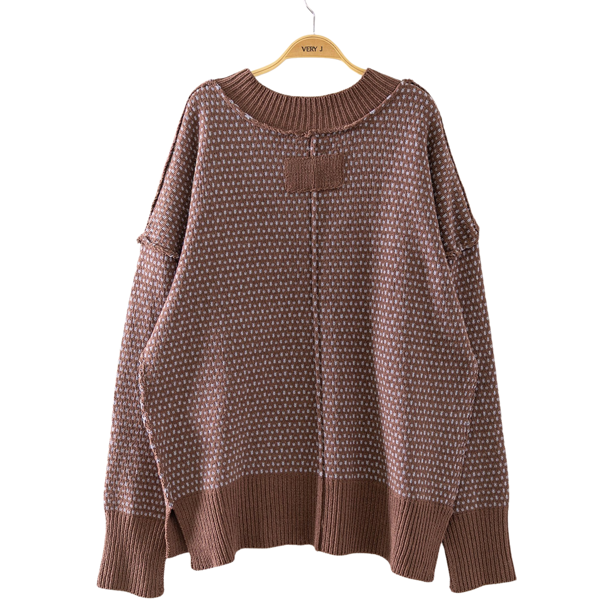 Elevate your wardrobe with this versatile Very J reversible sweater. Crafted in a rich chocolate color, it features a flattering v-neck and long sleeves for effortless layering through any season. The contrast stitching adds a refined detail, while the reversible design gives you two looks in one piece—dress it up or down depending on your mood. Perfect for transitional weather or pairing with your favorite basics.