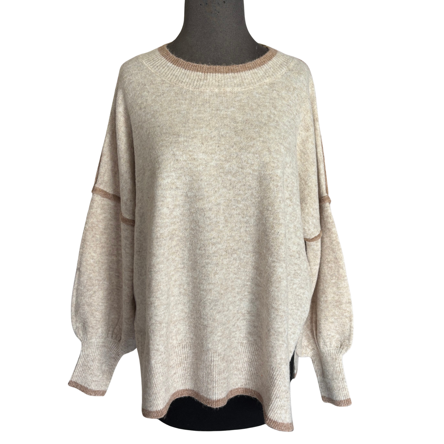 This She+Sky Contrast Sweater Top in oatmeal offers a refined blend of comfort and style. Crafted with soft fabric and featuring long sleeves, it provides cozy warmth while maintaining breathability. Its versatile oatmeal hue pairs effortlessly with any wardrobe, making it a practical choice for layering in cooler weather. Ideal for those seeking everyday comfort with a polished look, this sweater elevates casual outfits with subtle sophistication.