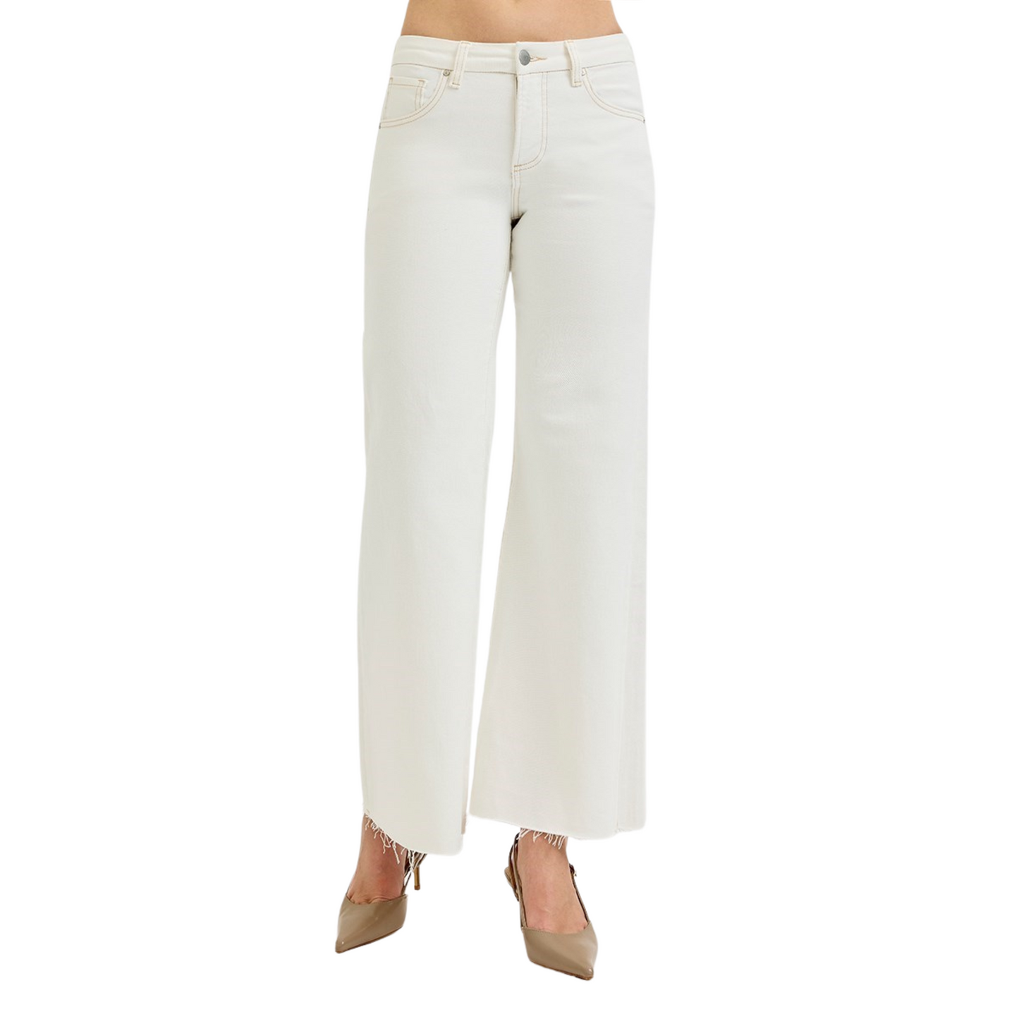 These cream-colored Mid Rise Wide Leg Pants from Risen offer a sophisticated silhouette with a comfortable mid-rise fit. The wide-leg design provides ease of movement and a flattering drape, making them ideal for both professional and casual settings. Crafted to combine style and comfort, these pants are a versatile addition to any wardrobe.