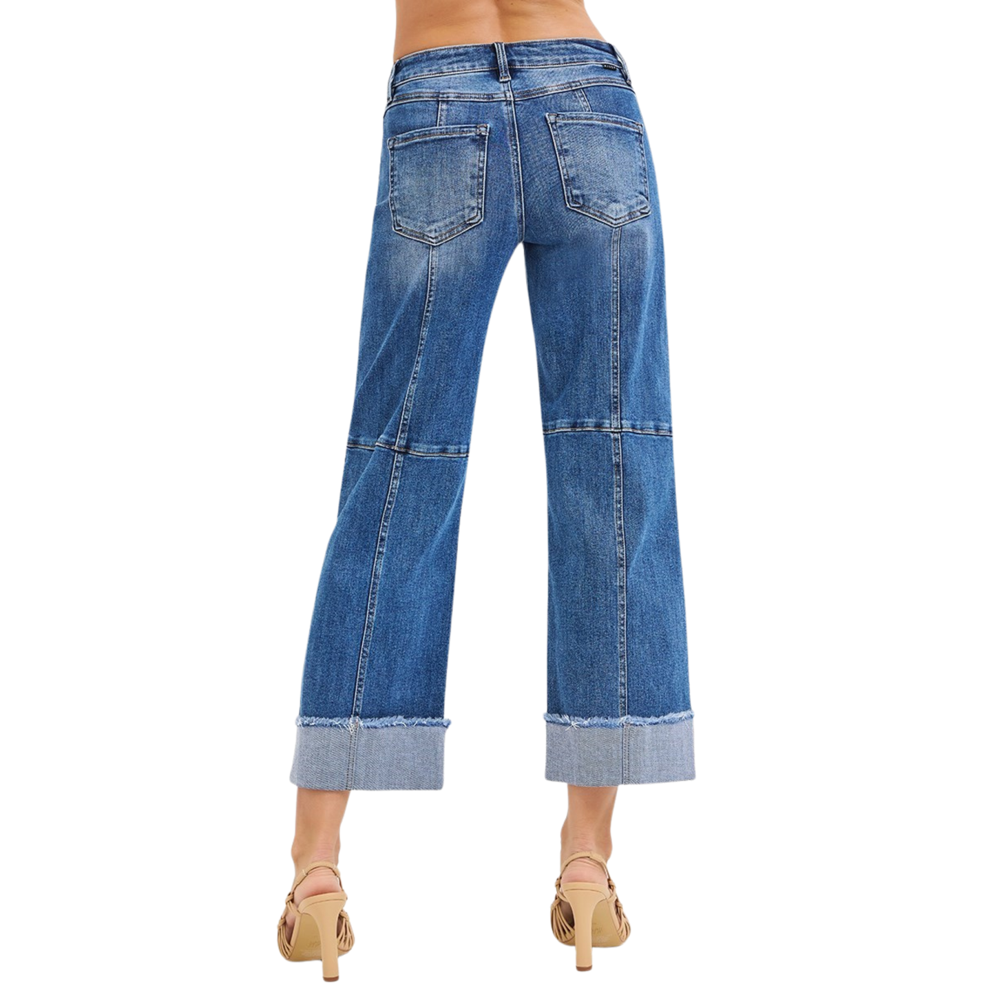 Cropped Wide Seam Detail Jeans by Risen offer a modern silhouette with bold seam detailing and a relaxed wide-leg fit. Crafted in a versatile medium wash denim, these jeans feature a cropped length perfect for pairing with sneakers or heels. The distinctive wide seams add contemporary edge while the comfortable wide-leg cut provides effortless style and movement. A wardrobe essential that transitions seamlessly from casual to dressed-up looks.