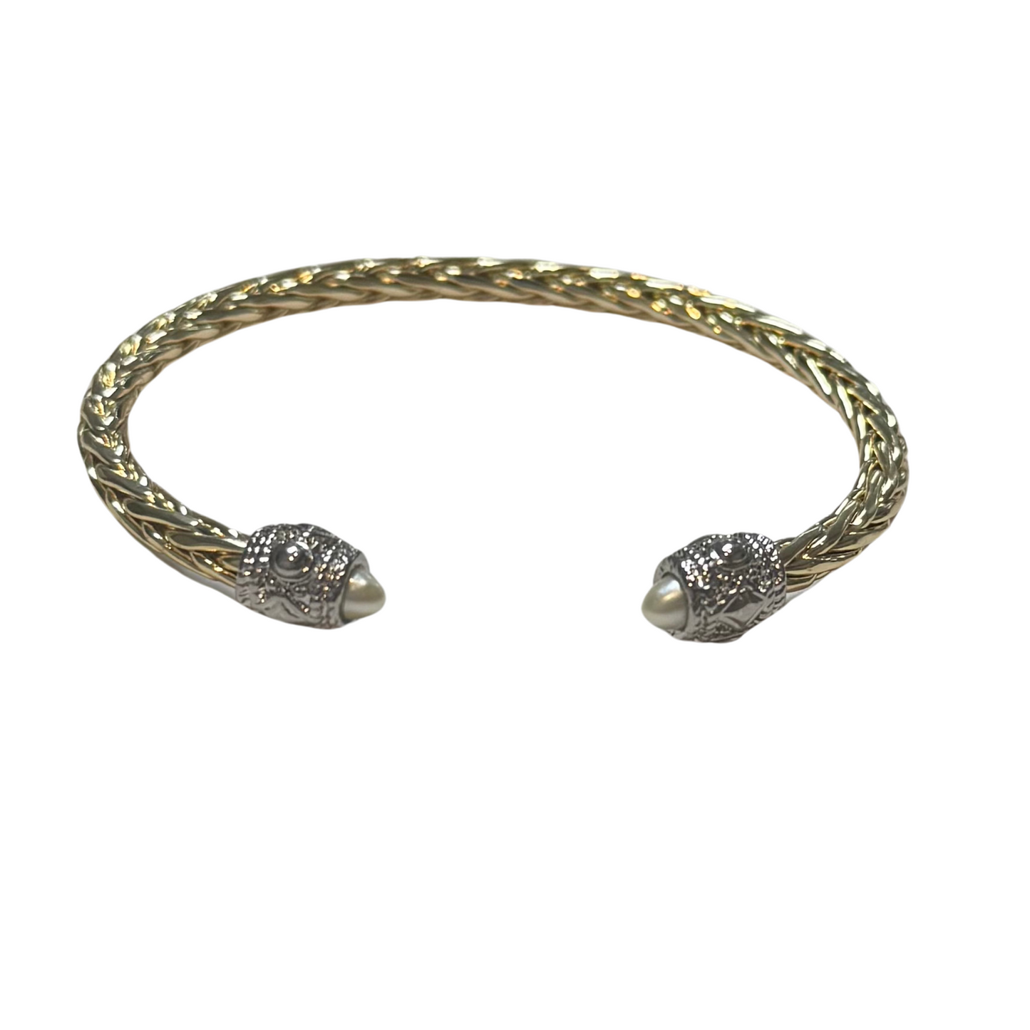Crafted with high-quality gold, this elegant twisted bangle is a must-have accessory. The exquisite pearl accent adds a touch of sophistication to any outfit. Elevate your style with this versatile and timeless cuff bangle.
