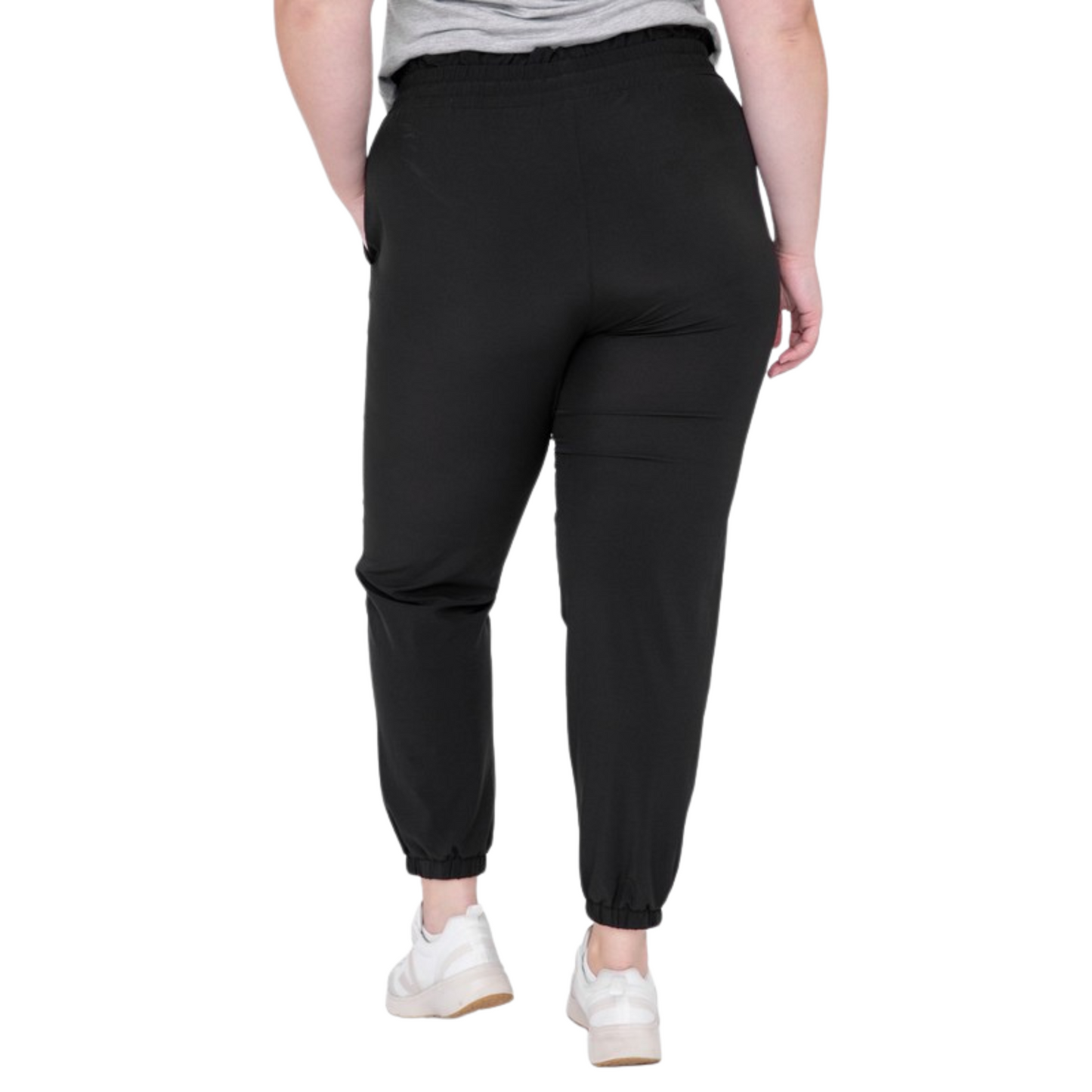 Be ready for your next adventure with these Curvy High Waisted Joggers. Crafted from premium fabric, they feature a high and elasticized waistband with drawstring closure, slanted pockets, and 7/8 length with cuffed ankles for a stylish look. Available in classic black color.