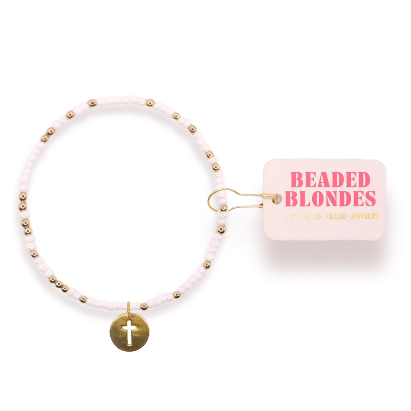 Elevate your wrist with this stunning Cross Cutout Charm Bracelet from Beaded Blondes. Crafted with lustrous white and gold beads, this piece combines timeless elegance with meaningful symbolism. The intricate cut-out cross charm serves as a beautiful focal point, making it perfect for everyday wear or special occasions. A versatile accessory that complements any style while adding a touch of grace and sophistication to your look.