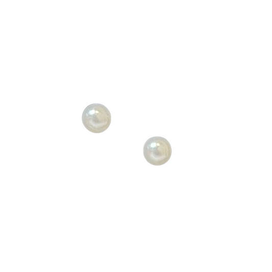 These delicate Small Pearl Studs from ete brand add a touch of elegance to any outfit. Made with dainty pearl studs, they exude a timeless and classic style. Perfect for any occasion, their simple yet sophisticated design will elevate your look.