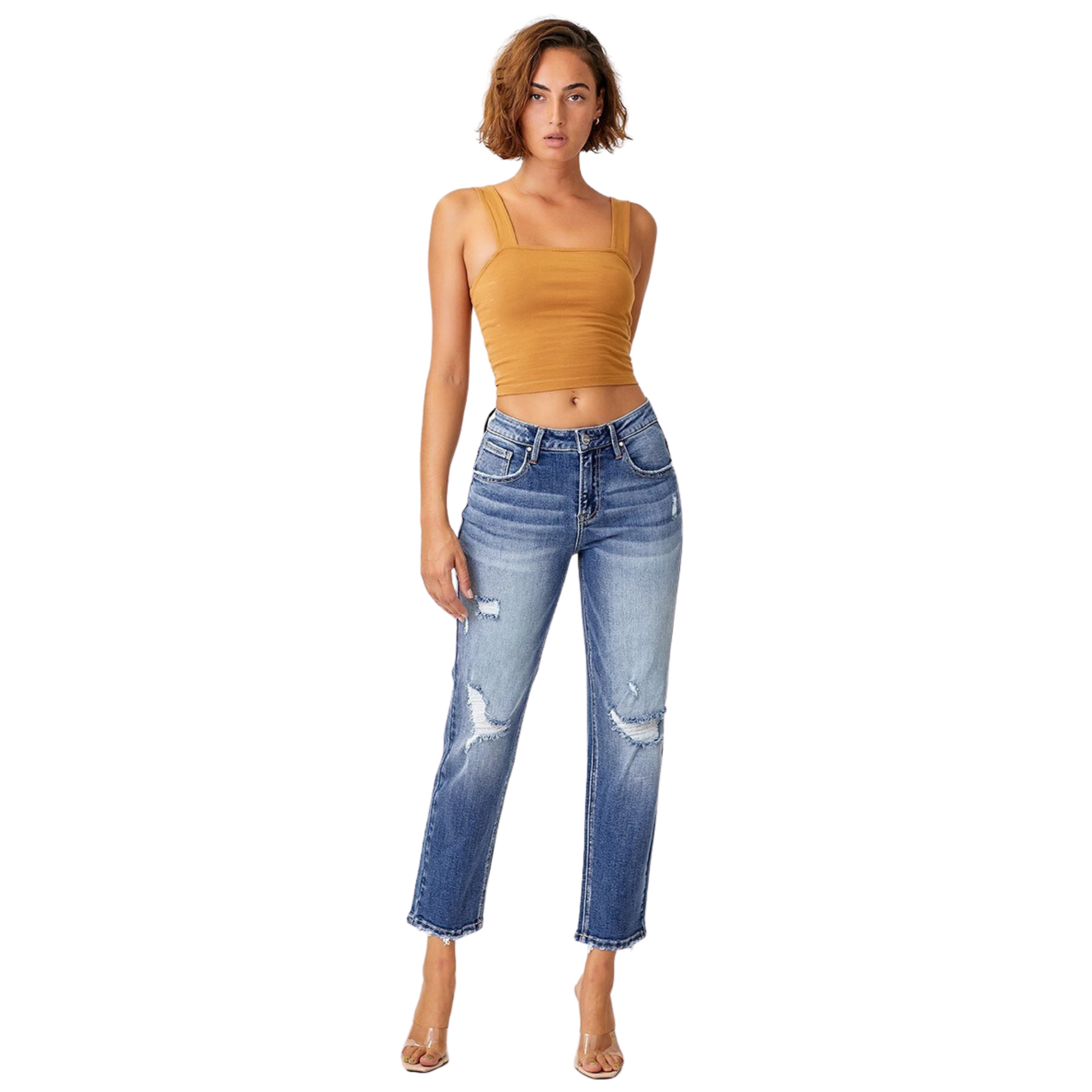 These Mid Rise Distressed Boyfriend Jeans from Risen Brand are perfect for a casual and comfortable look. They feature a dark wash, a cropped fit, and stylish distressed details. Create a unique and fashionable look with these high-quality jeans.