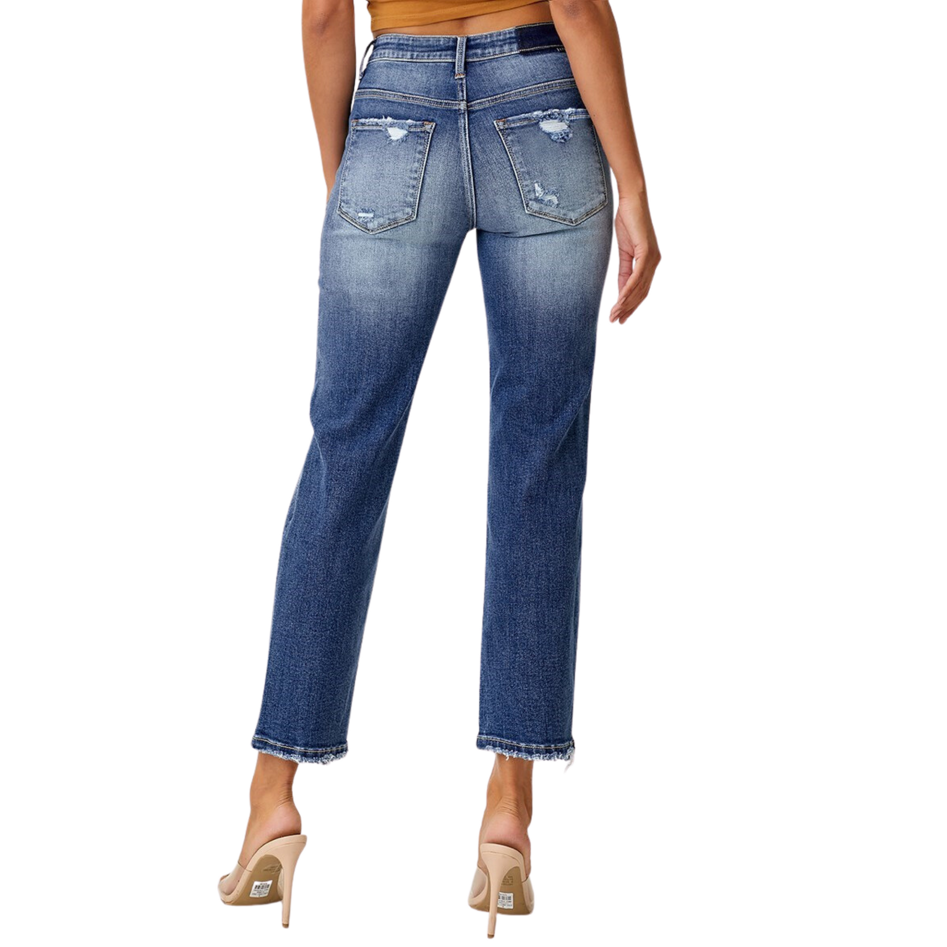 These Mid Rise Distressed Boyfriend Jeans from Risen Brand are perfect for a casual and comfortable look. They feature a dark wash, a cropped fit, and stylish distressed details. Create a unique and fashionable look with these high-quality jeans.
