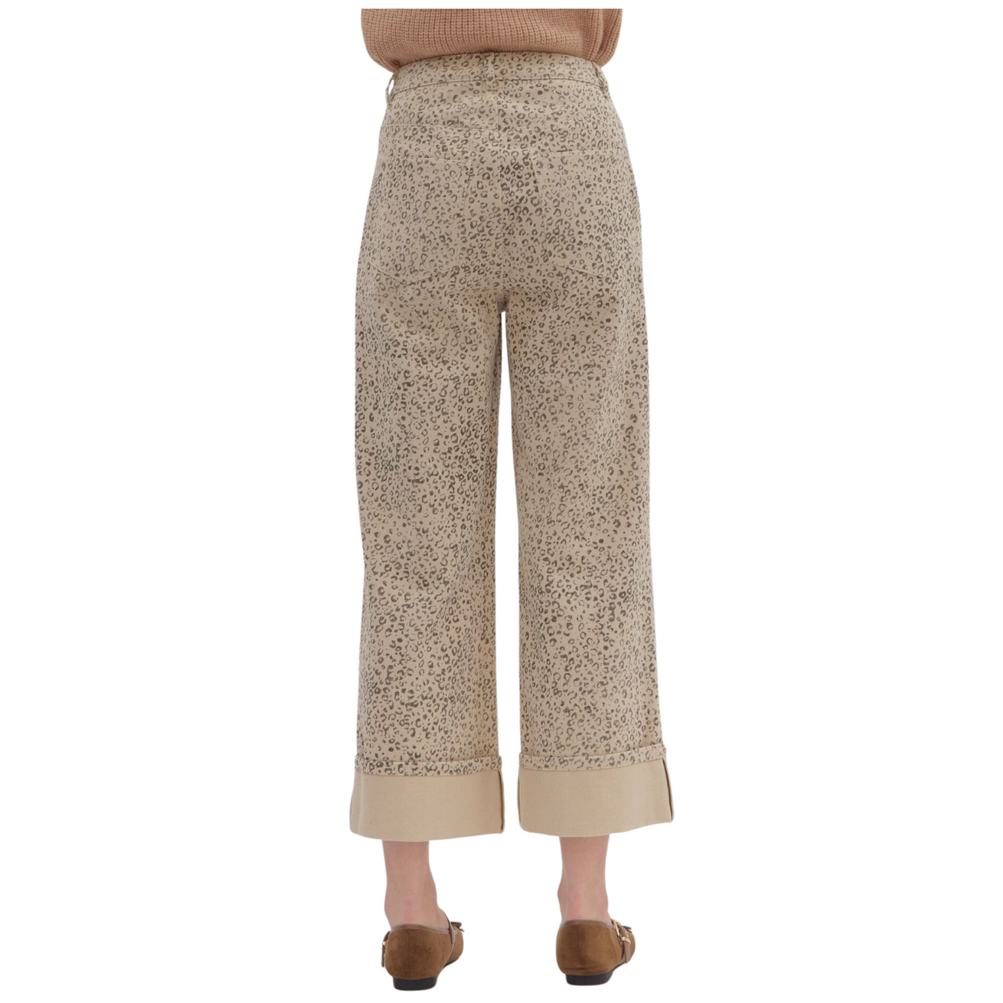 These High Waist Wide Leg Pants from Entro combine style and comfort with a trendy leopard print on a soft ecru background. Designed with a cropped length and a wide hem, they offer a flattering silhouette that balances fashion-forward aesthetics with relaxed wearability. Perfect for elevating your wardrobe with a bold yet sophisticated statement piece.
