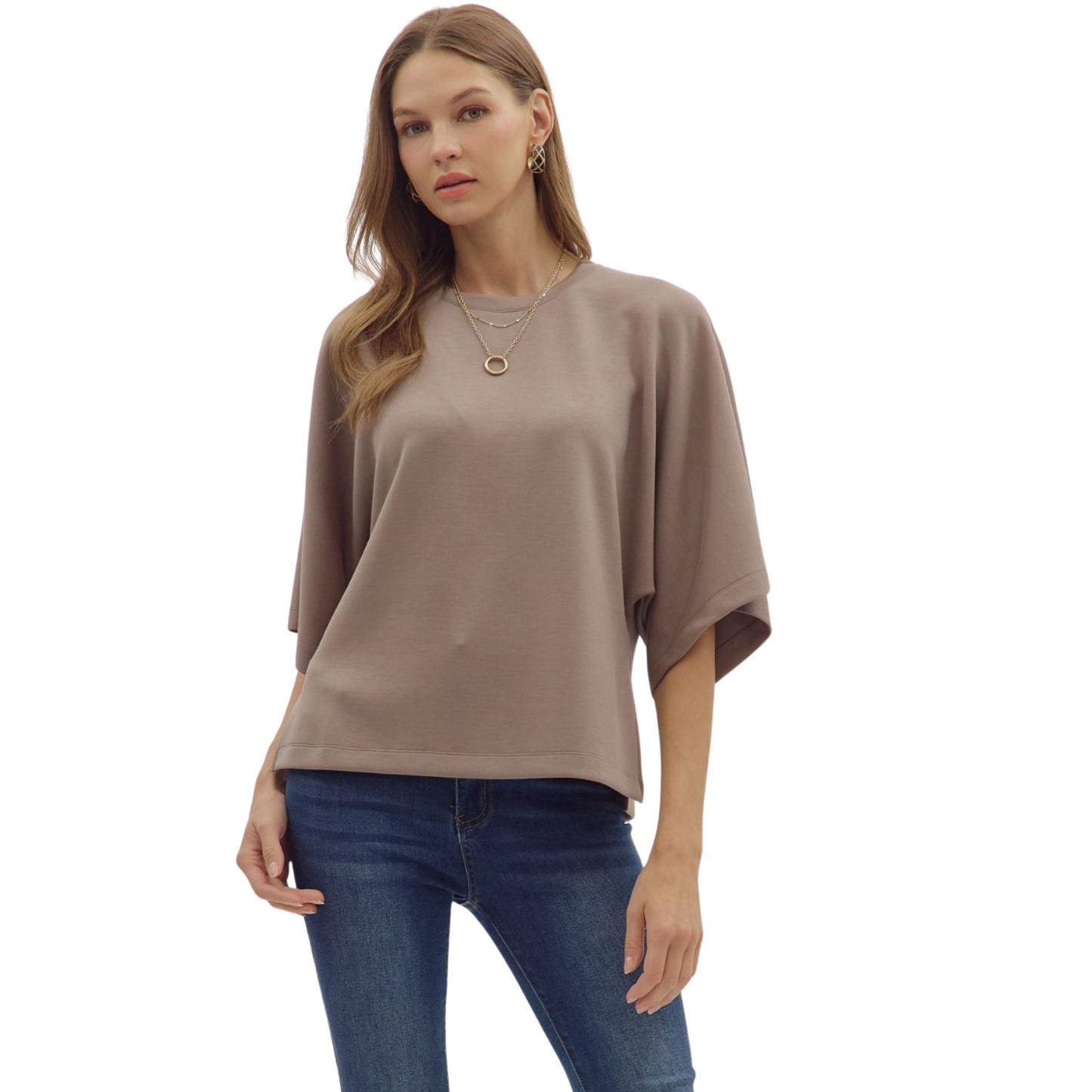This mocha-colored top from Entro offers a relaxed, loose fit designed for comfort and style. Featuring 3/4 length sleeves, it provides a balanced look that’s perfect for layering or wearing alone. The soft fabric and subtle hue make it a versatile addition to any wardrobe, suitable for both casual and refined occasions.