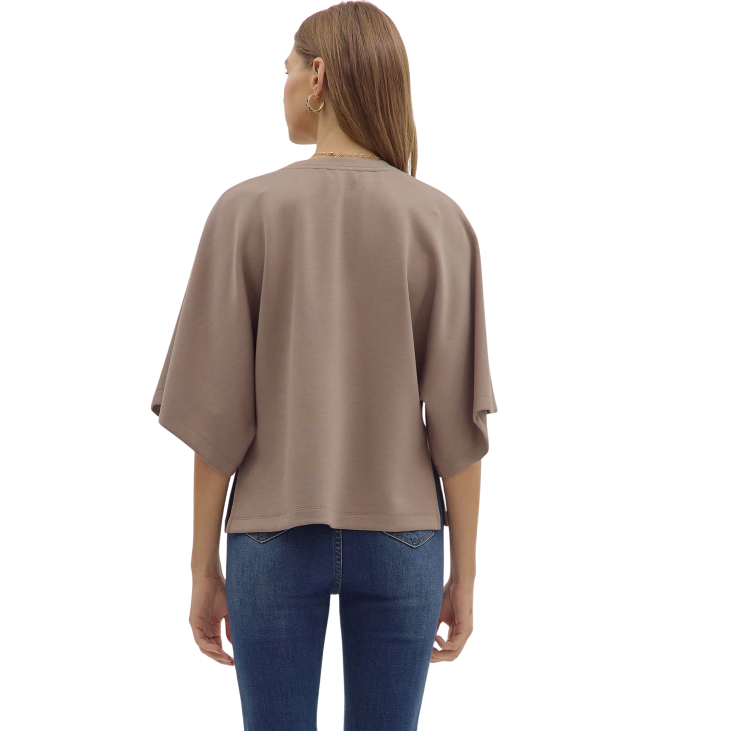 This mocha-colored top from Entro offers a relaxed, loose fit designed for comfort and style. Featuring 3/4 length sleeves, it provides a balanced look that’s perfect for layering or wearing alone. The soft fabric and subtle hue make it a versatile addition to any wardrobe, suitable for both casual and refined occasions.