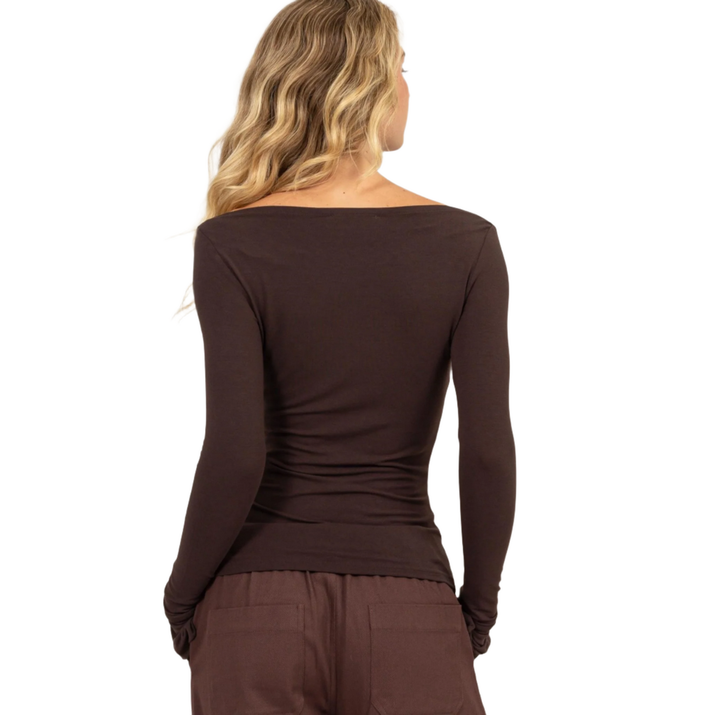 This boat neck long sleeve top in espresso features a flattering boat neckline and a slim fit silhouette, making it an essential addition to your wardrobe. Crafted from a soft, stretchy fabric, it ensures all-day comfort and a perfect fit. The long sleeves provide added warmth, while the simple design allows for versatile styling. Pair this elegant top with your favorite jeans, skirt, or shorts for a chic and polished look, suitable for both casual and dressy occasions. 