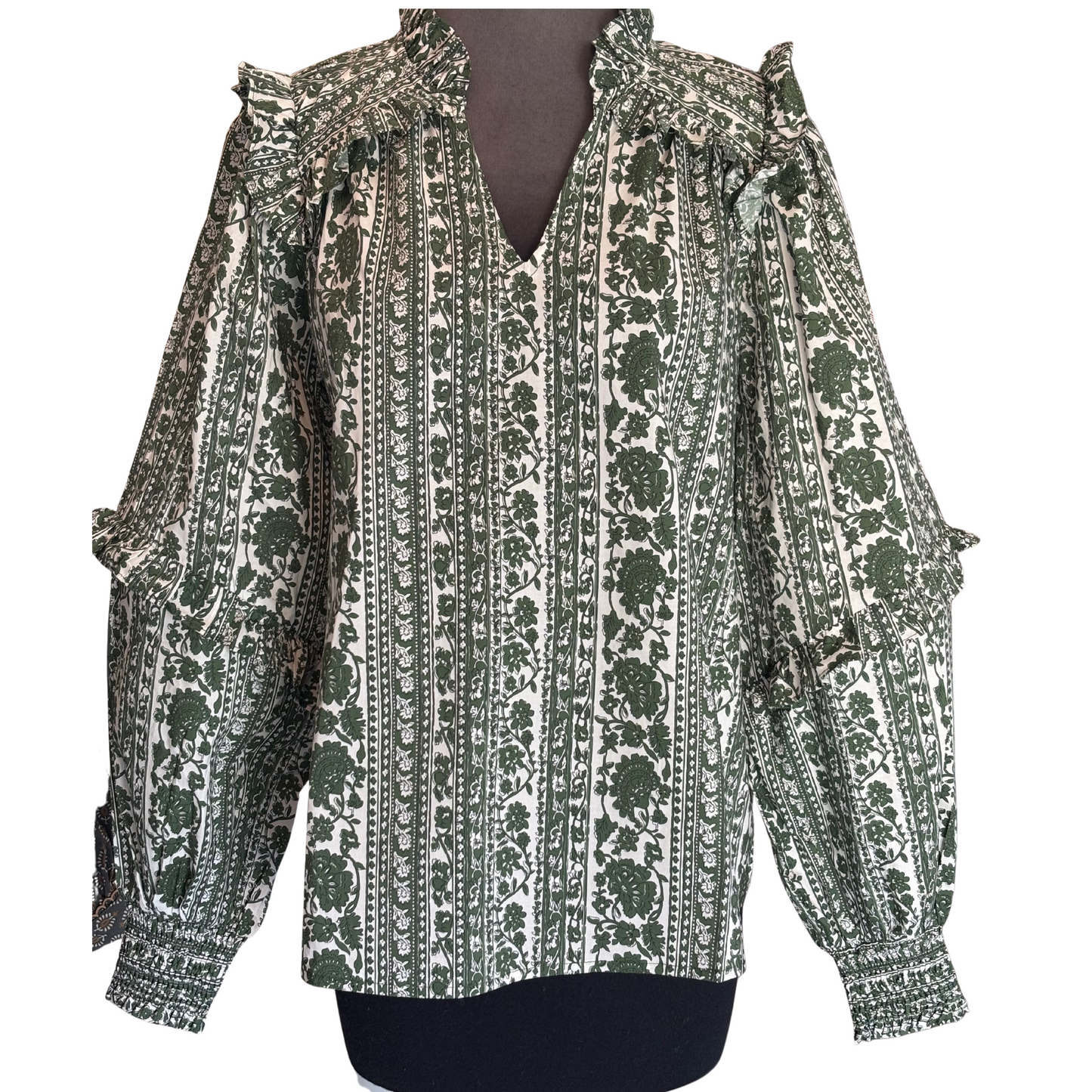 This olive-colored Floral Long Sleeve Top by Entro offers a refined blend of style and comfort. Crafted from a lightweight woven fabric, it features a delicate floral stripe print and a ruffled V-neckline enhanced with shoulder and back yoke flounces. The smocked sleeve openings ensure a secure yet comfortable fit. Unlined and non-sheer, this top provides breathable wear while maintaining a polished look suitable for various occasions.