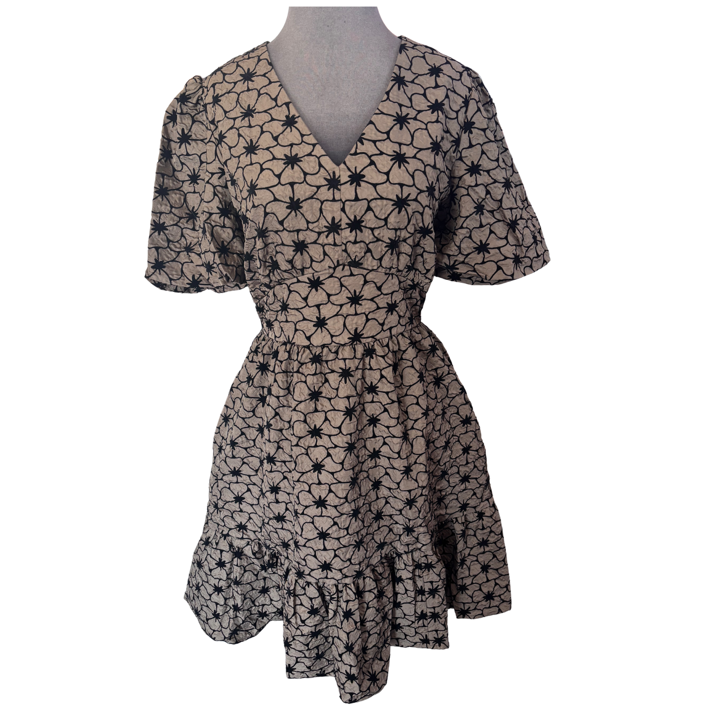 Elevate your casual wardrobe with this charming She+Sky mini dress. Featuring a flattering V-neckline and delicate puff sleeves, it combines comfort with style. The mocha hue pairs beautifully with an intricate floral print, while the elastic waistband ensures a perfect fit all day long. Ideal for warm weather outings, brunch dates, or effortless weekend looks.