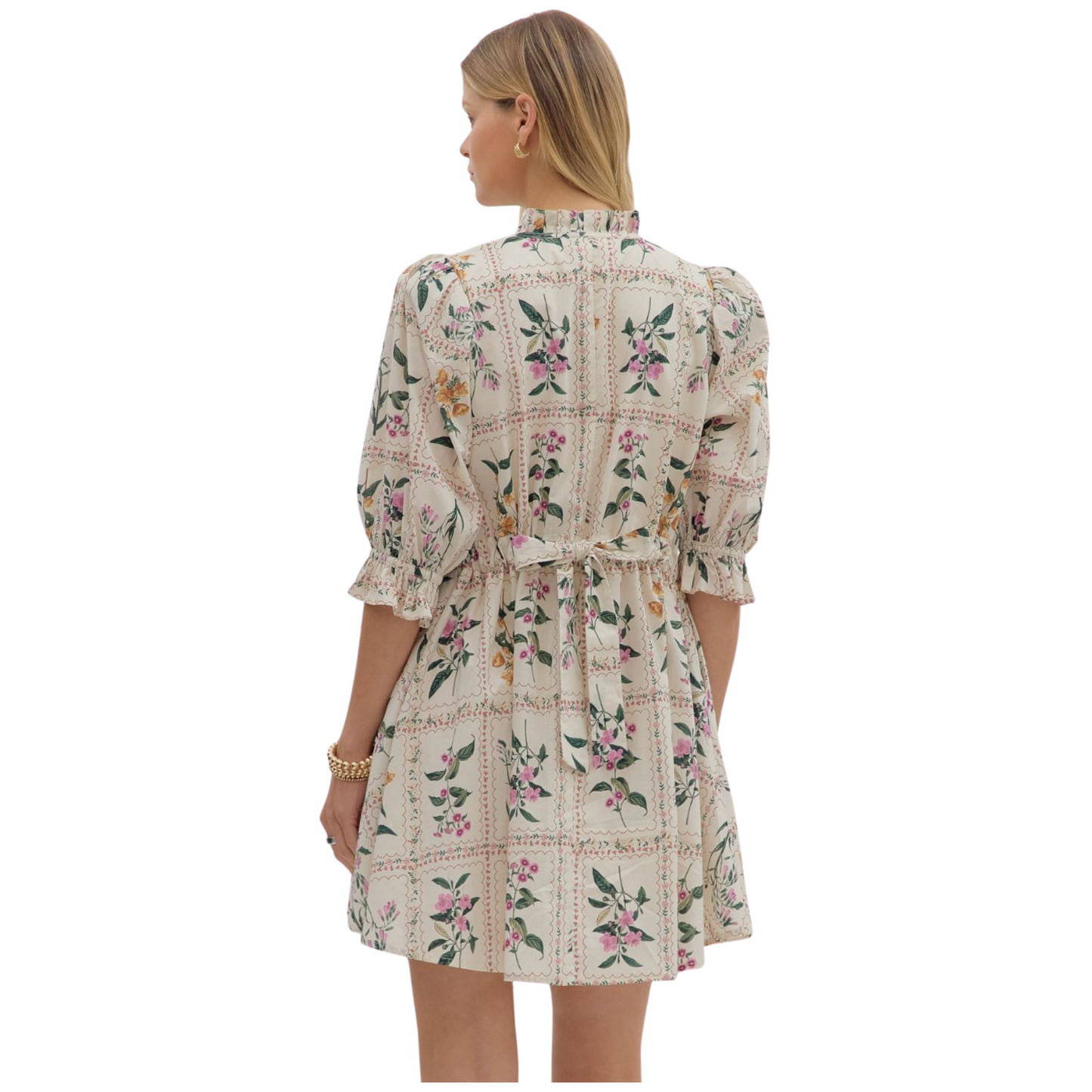 Floral panel ¾ ruffle finish puff sleeve pleated round neck button closure at front mini dress featuring adjustable back waist. Side pockets. Lined. Woven. Non-sheer. Lightweight.