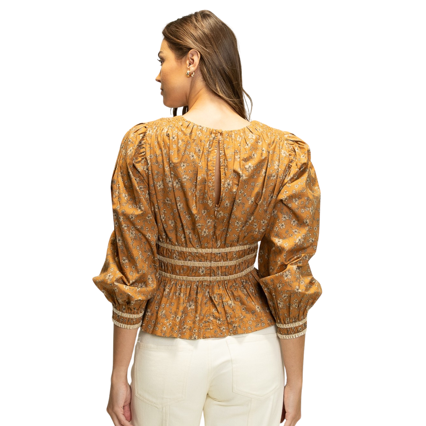 Elevate your wardrobe with the HEYSON Smocked Waist Peplum Top in a warm cinnamon hue. Featuring a delicate floral pattern, this top combines classic femininity with modern styling. The smocked waist ensures a flattering, comfortable fit while the peplum silhouette adds subtle shape and elegance. Perfect for transitioning from casual days to chic evenings, this piece offers both versatility and timeless appeal.