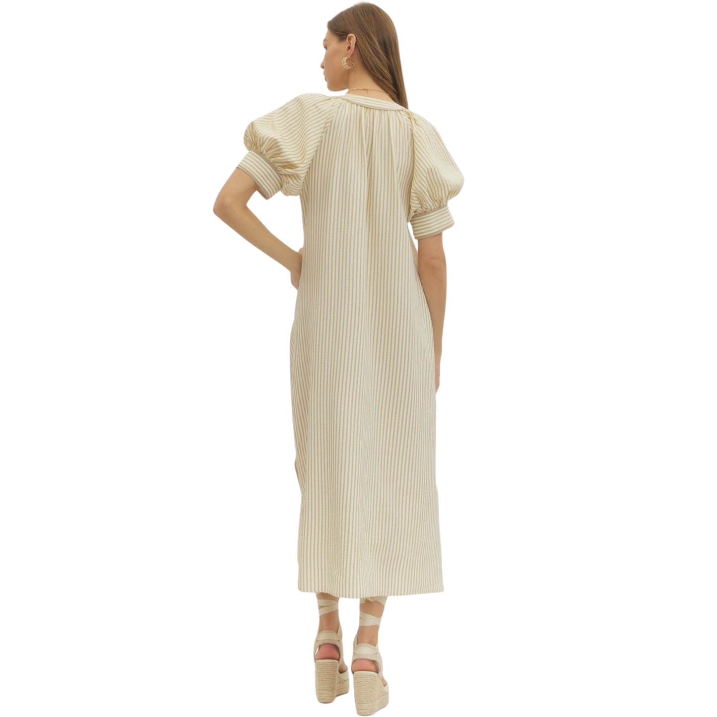 Elevate your wardrobe with this sophisticated V-neck maxi dress from Entro, crafted in a warm oatmeal tone that complements all skin tones. Delicate flower embroidery adorns the fabric, adding refined texture and visual interest to this timeless silhouette. The flowing maxi length provides elegant coverage while the V-neckline creates a flattering, elongating effect. Perfect for special occasions, garden parties, or elevated everyday wear, this dress seamlessly transitions from season to season.