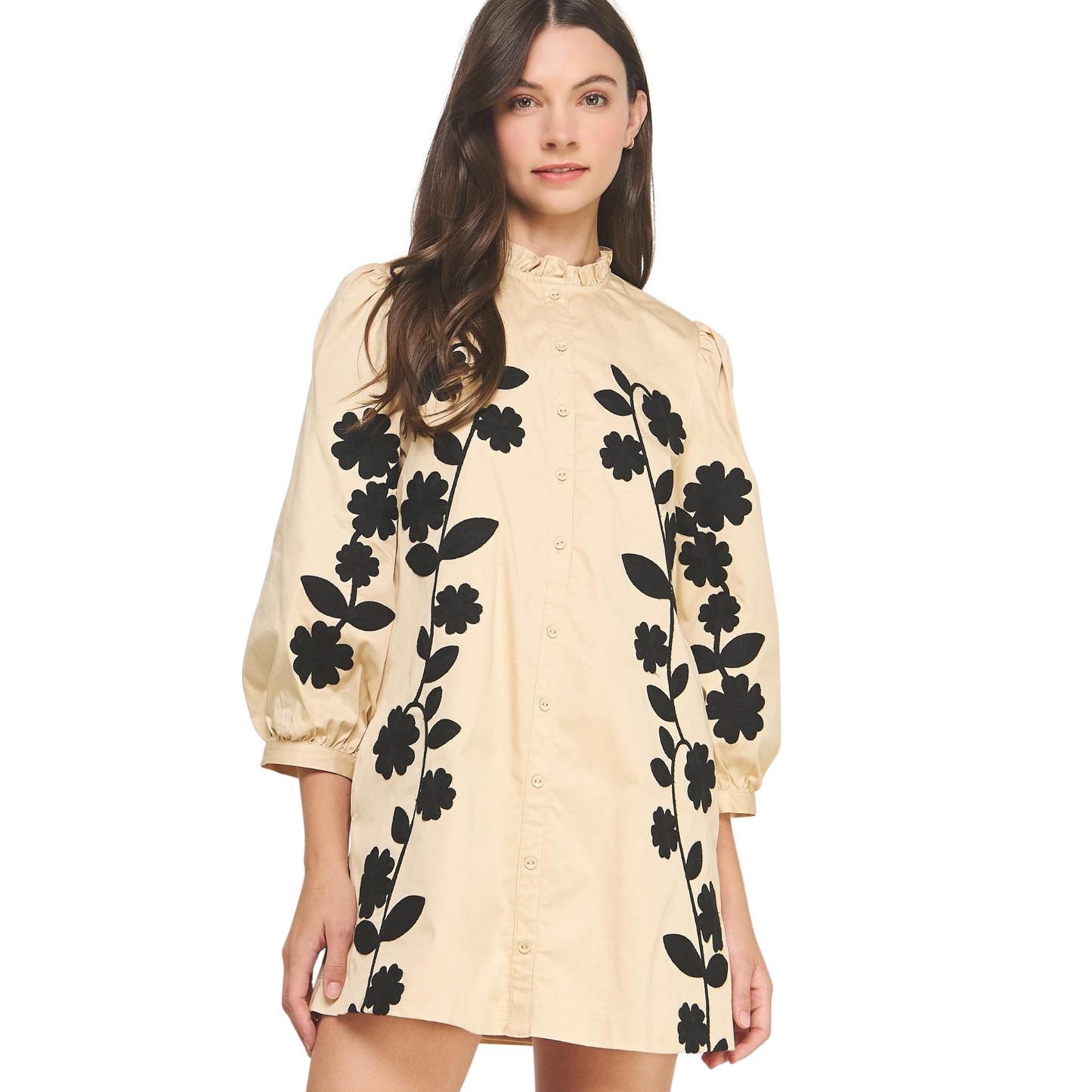 This Strut & Bolt mini dress combines sophisticated design with playful details. Featuring delicate flower embroidery on the sleeves, it adds a touch of artistry to the black and sand color palette. The ruffle neck enhances its feminine silhouette, making it perfect for stylish daytime events or evening outings. Crafted for a flattering fit, this dress balances elegance and comfort effortlessly.