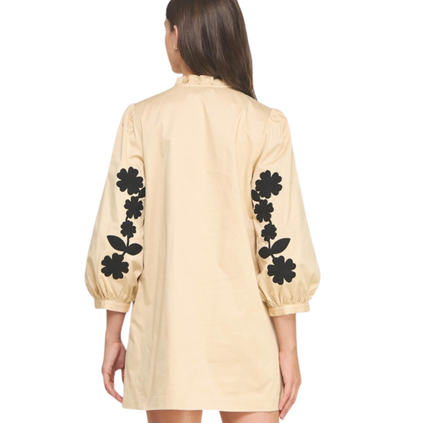 This Strut & Bolt mini dress combines sophisticated design with playful details. Featuring delicate flower embroidery on the sleeves, it adds a touch of artistry to the black and sand color palette. The ruffle neck enhances its feminine silhouette, making it perfect for stylish daytime events or evening outings. Crafted for a flattering fit, this dress balances elegance and comfort effortlessly.