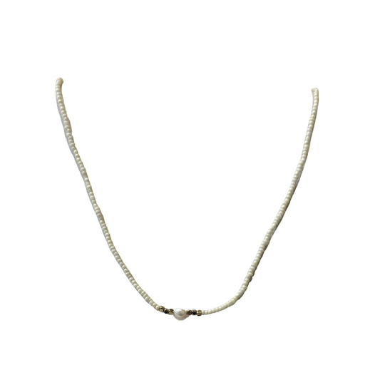 Experience timeless elegance with this freshwater pearl necklace. Each hand-crafted bead adds a touch of sophistication to any outfit. The necklace's short length makes it perfect for pairing with a variety of necklines. The freshwater pearl accent adds a natural and luxurious touch.