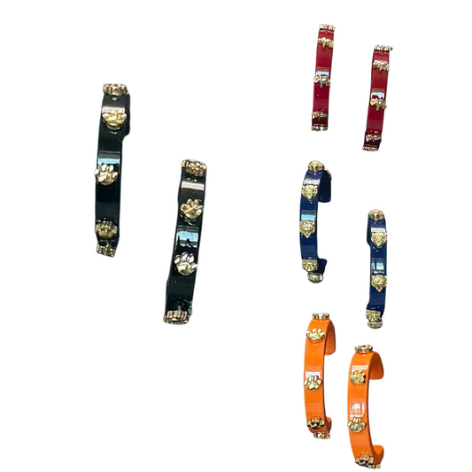 Elevate your game day look with these vibrant hoop earrings from Golden Stella. Available in black, red, navy, or orange, they offer a perfect way to show team spirit with stylish color options. Crafted to complement any fan’s outfit, these earrings combine boldness and comfort, making them ideal for cheering on your team in style.