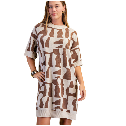 This brown geometric print sweater dress from GiGio combines expert tailoring with modern design. Crafted with short sleeves for comfortable wear, its structured silhouette highlights the striking geometric pattern, making it a versatile piece for both casual and polished looks. Ideal for those seeking a sophisticated yet effortless style statement.