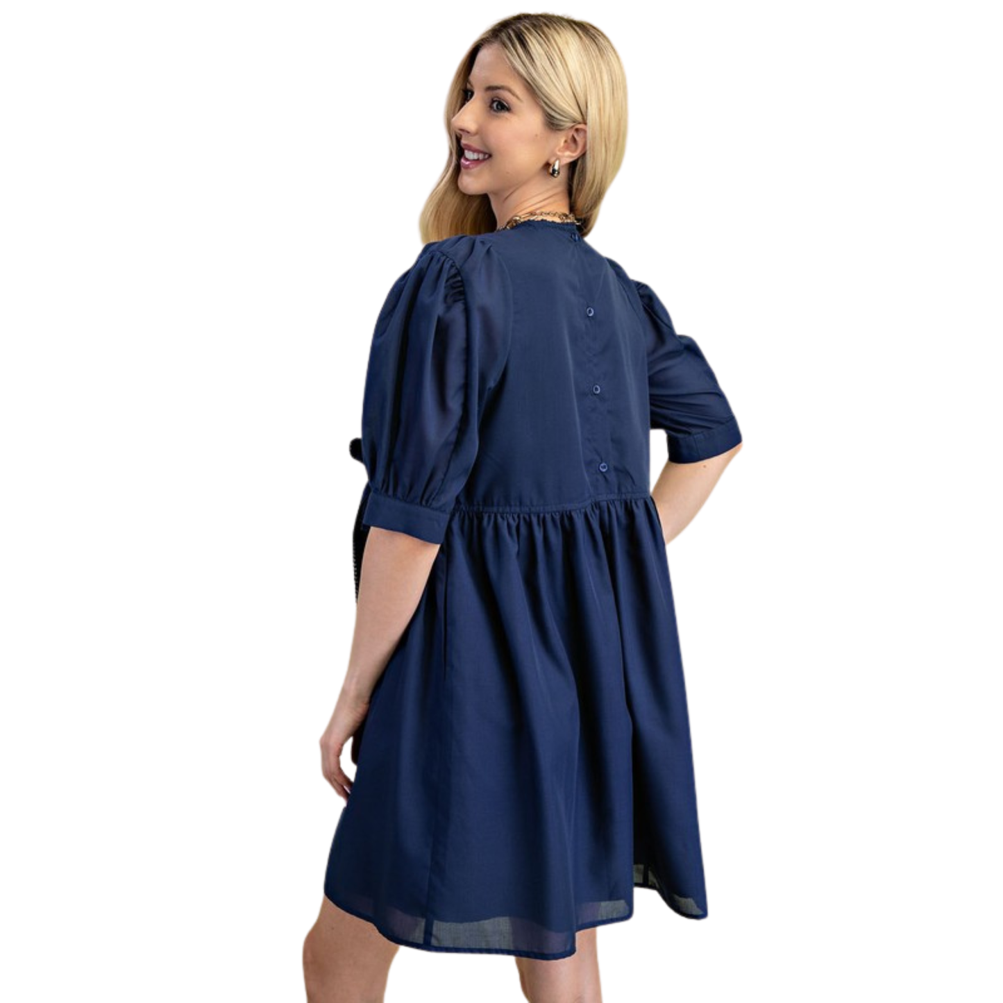 Elevate your wardrobe with this charming navy mini dress from GiGio. Featuring romantic puff sleeves and a classic round neckline, this piece effortlessly transitions from day to night. The flattering silhouette and timeless color make it a versatile staple for any occasion. Perfect for creating polished, feminine looks with minimal effort.