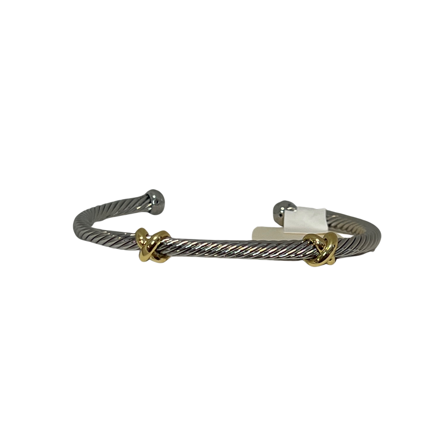 This classic twisted bangle offers timeless elegance with its silver and gold color scheme. Crafted from durable metal, the cuff design adds a unique touch to any wardrobe. Show off your modern style with this beautiful bangle.