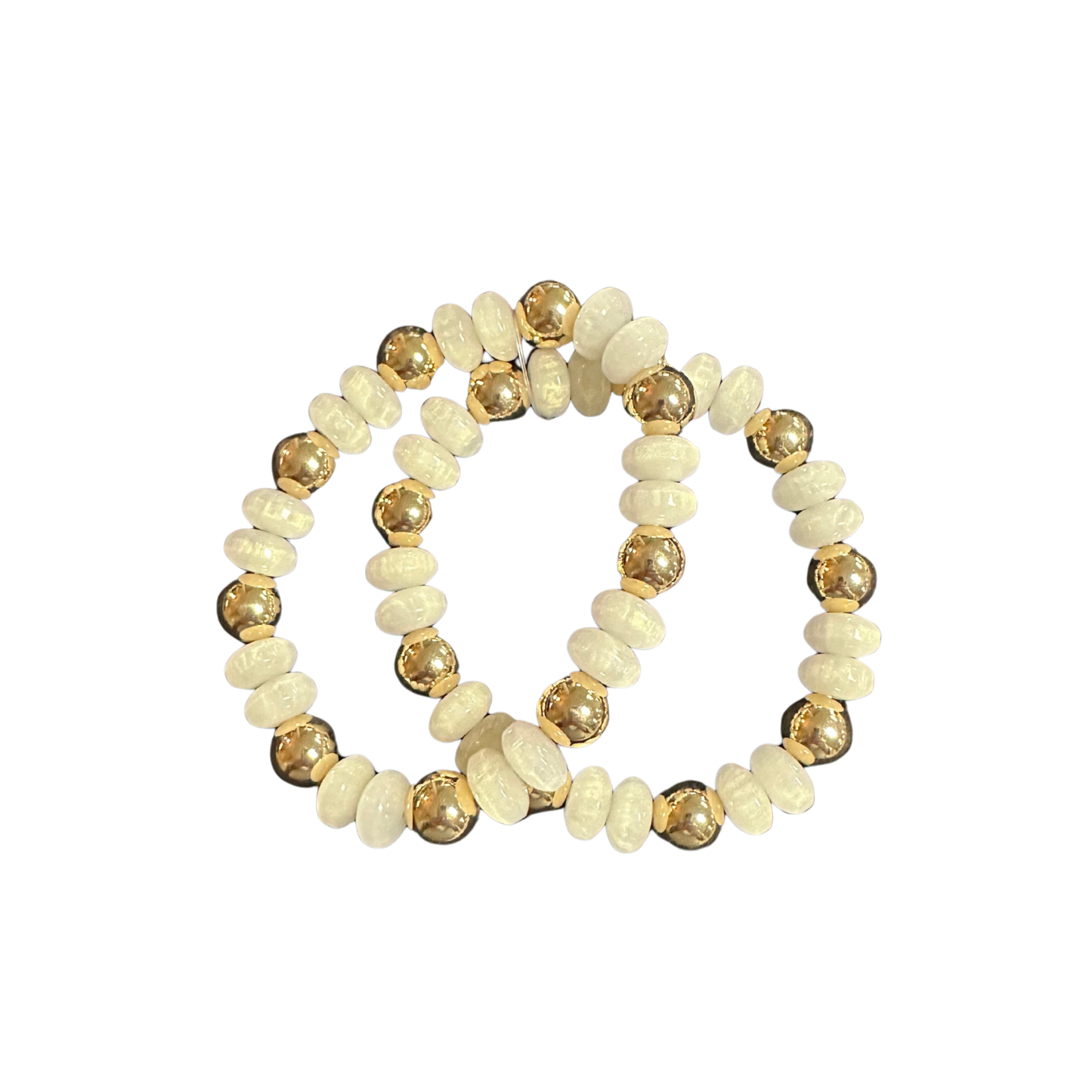 Elevate your everyday accessory collection with this sophisticated two-piece bracelet set from Perdido Gems. Each stretchy bracelet features a refined combination of lustrous gold and crisp white beads, offering versatile styling options for any occasion. The elastic construction ensures a comfortable, adjustable fit for all wrist sizes. Layer them together for a bold statement or wear individually for understated elegance. A timeless addition to your jewelry wardrobe that seamlessly transitions from casual