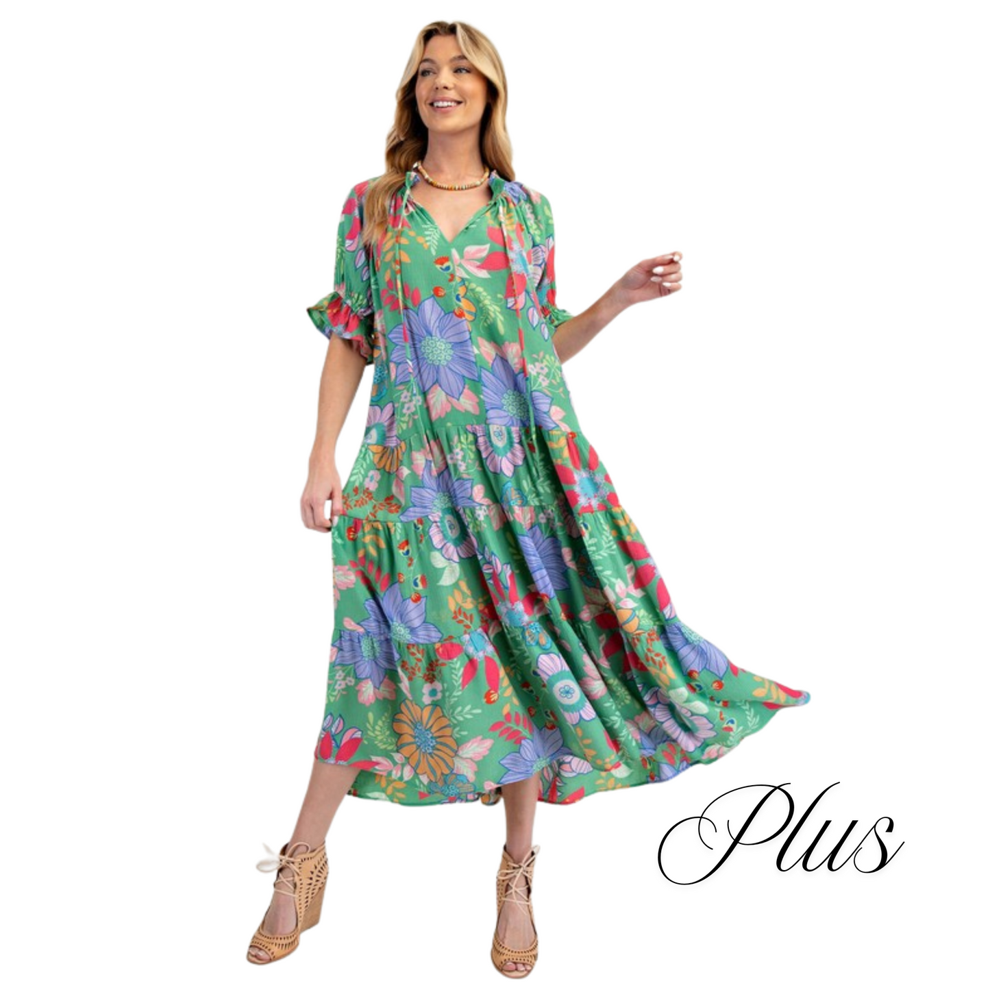 Introducing the Peach Blossom Maxi Dress, designed with plus size women in mind. Featuring a beautiful printed design, bubble short sleeves with ruffle ends, and a notched V neck with adjustable tie closure for the perfect fit. With a tiered and ruched bottom, this relaxed and loose fitting dress is both comfortable and stylish. And for added convenience, it also includes side pockets. From the trusted Easel brand, this green dress is a must-have for any wardrobe.