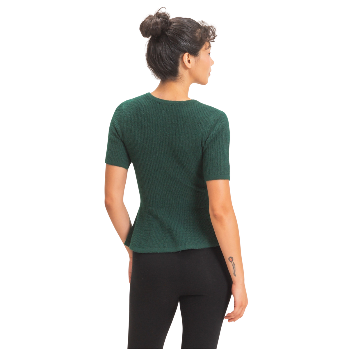 Elevate your wardrobe with this stunning Ribbed Peplum Knit Top from Double Zero. Crafted in a rich dark green, this piece combines timeless style with contemporary flair. The fitted ribbed knit hugs your silhouette while the feminine peplum waist adds dimension and movement. Half sleeves keep it fresh and versatile—perfect for layering or wearing solo. Whether you're heading to the office or out for an evening, this knit top transitions seamlessly from day to night.