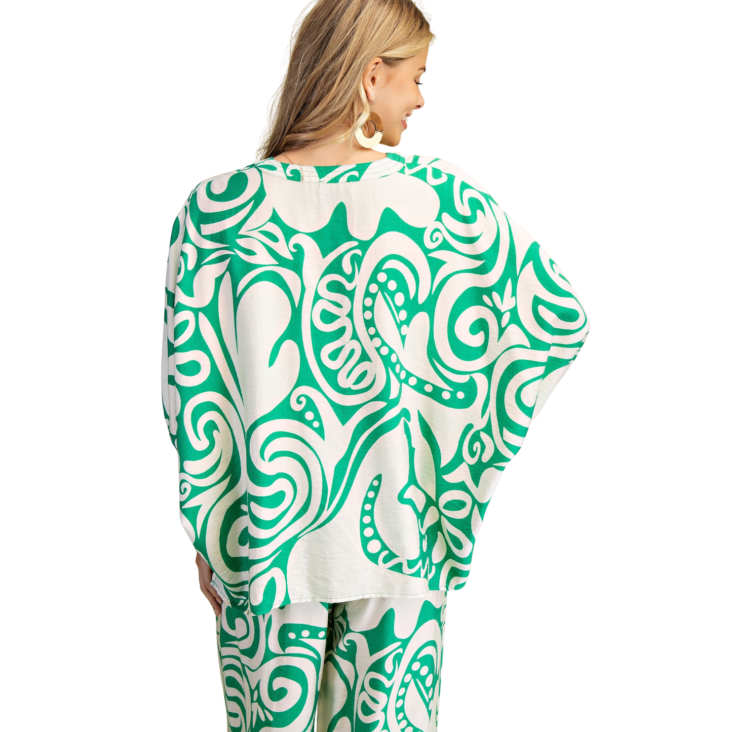 Elevate your casual wardrobe with this GiGio printed set featuring a striking green abstract design. The relaxed-fit top pairs perfectly with matching bottoms for an effortless, coordinated look. Soft, breathable fabric and short sleeves make it ideal for everyday comfort. Perfect for lounging, running errands, or casual outings.