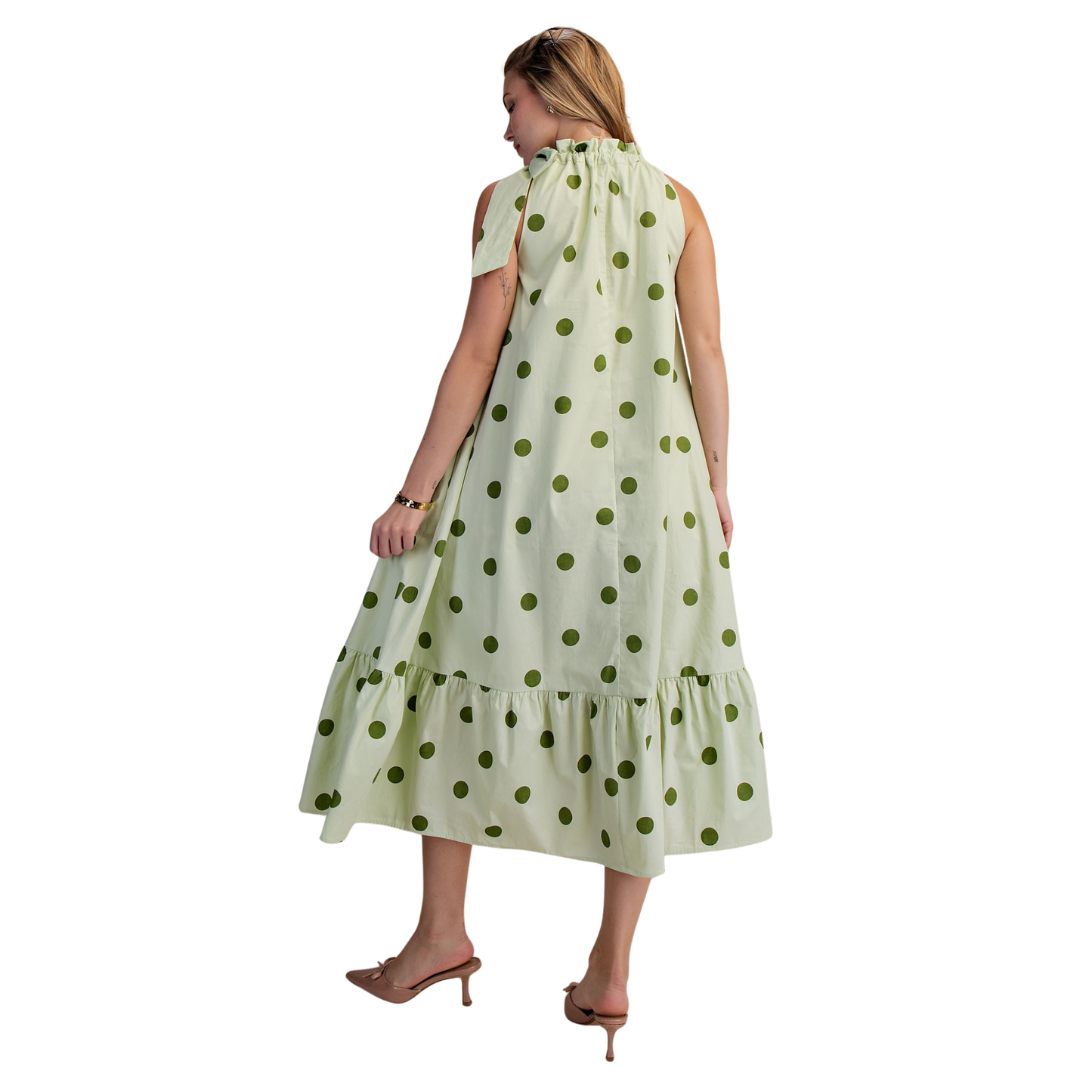Elevate your wardrobe with this stunning Halter Neck Midi Dress from Glam. The vibrant green fabric features playful polka dots that add a touch of retro charm to any occasion. The flattering halter neckline provides elegant support while the midi length offers a sophisticated silhouette perfect for brunch, date night, or casual gatherings. Comfortable, stylish, and effortlessly chic—this dress is a versatile essential for the modern woman.
