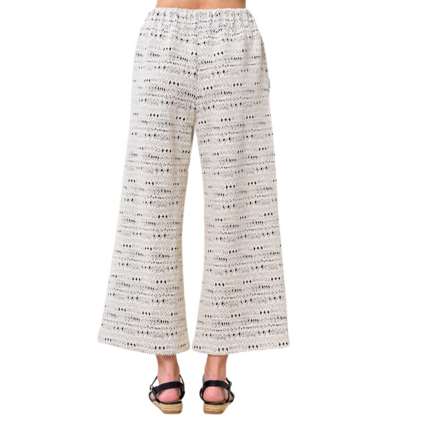 These plus size Jacquard Textured Pants feature an elastic waist and a wide leg for a comfortable, flattering fit. Crafted from a cream and grey jacquard fabric with an abstract print, they add a modern touch to any outfit.